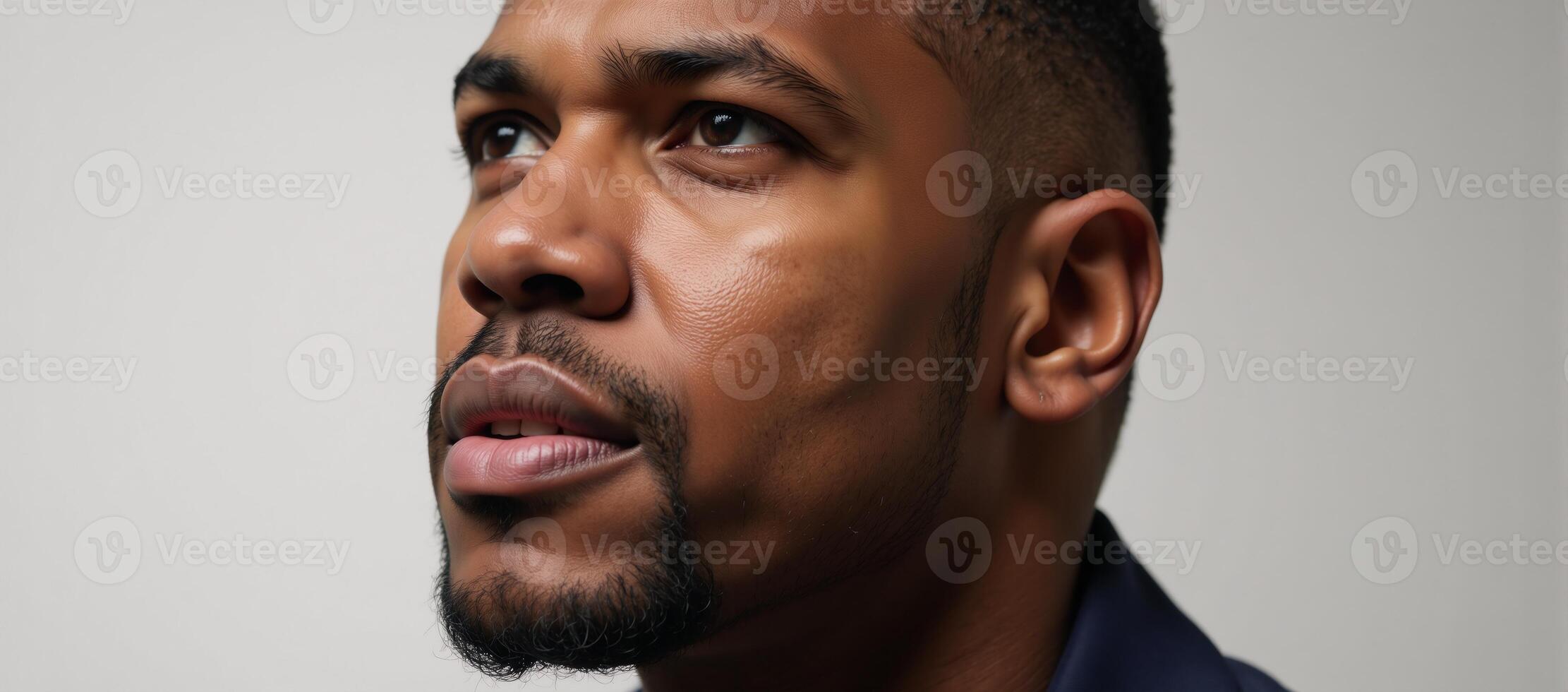 Closeup portrait showcasing an introspective African American male photo