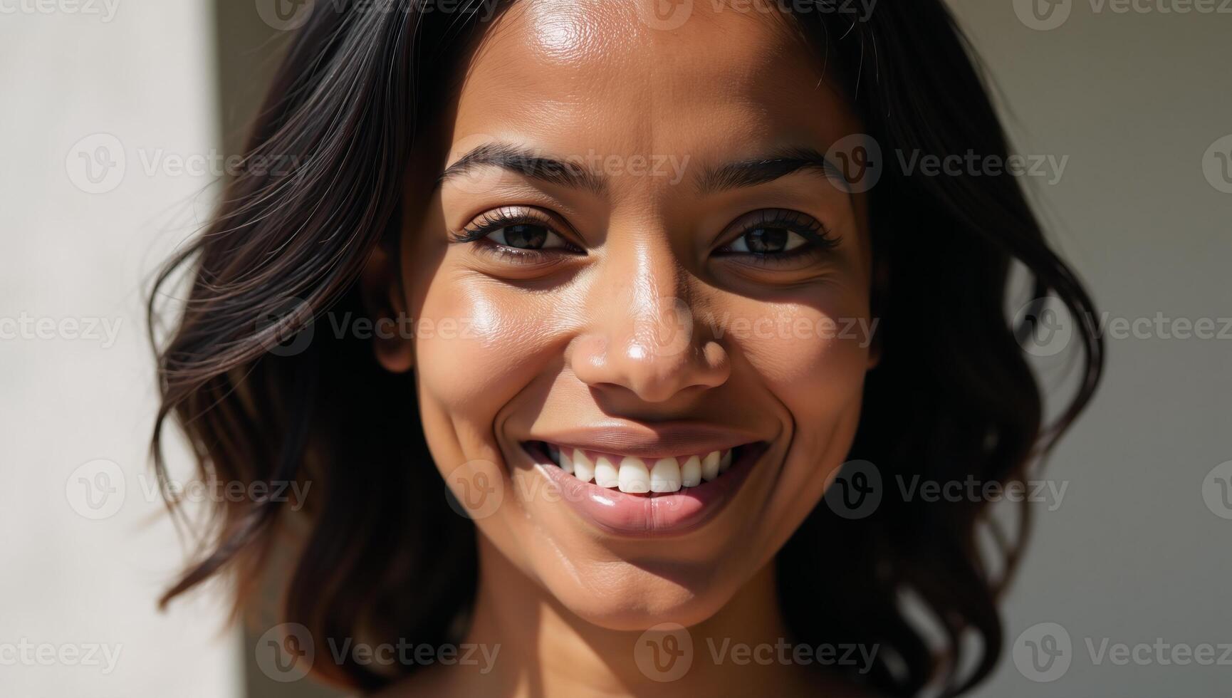 Portrait highlights striking beauty and elegance of a confident African American woman with stunningly styled black hair and radiant smile bathed in soft natural light photo