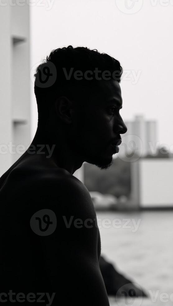 Black man silhouette captivating portrait of young AfricanAmerican male photo