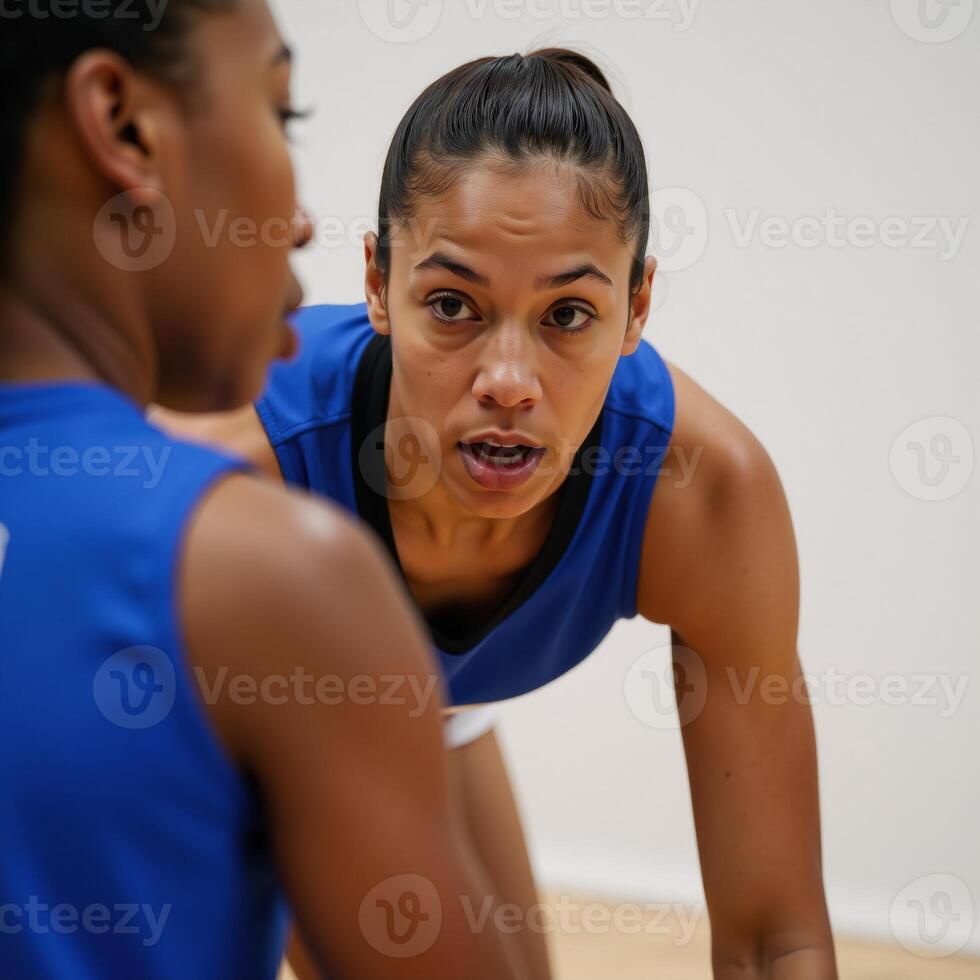 Closeup portrait of focused African American female basketball player with determination photo