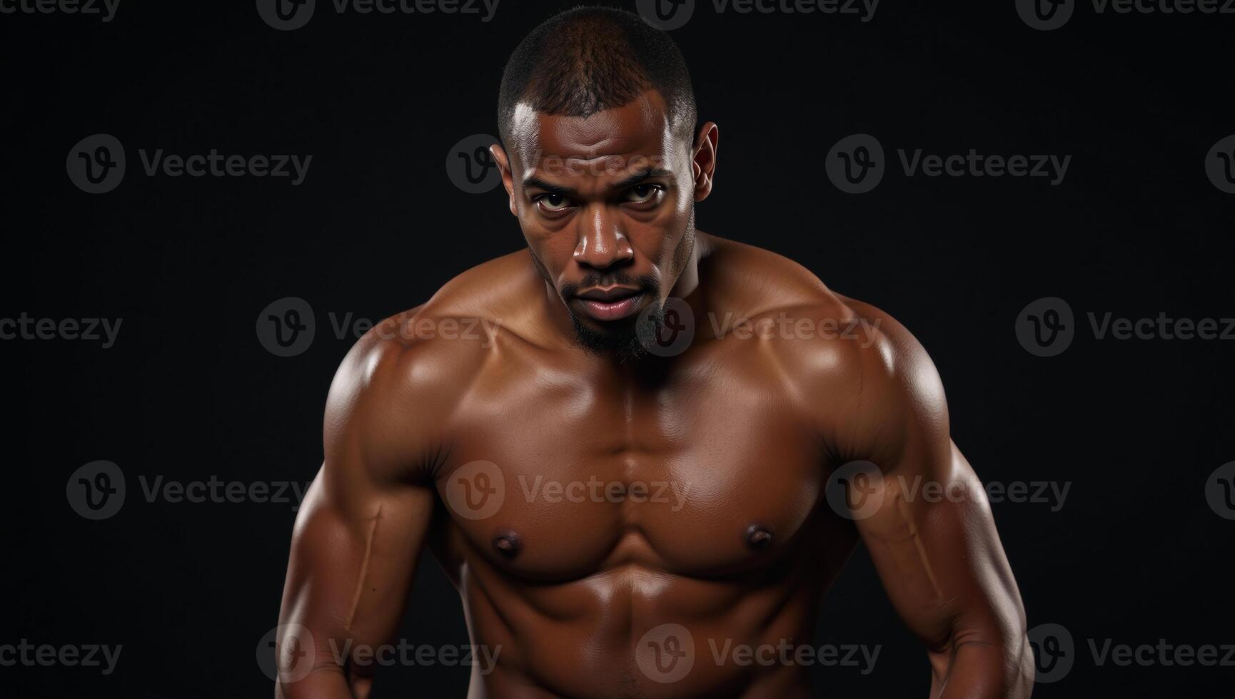 Muscular African American boxer with sweaty forehead leaning on left elbow and covering eyes with right hand photo