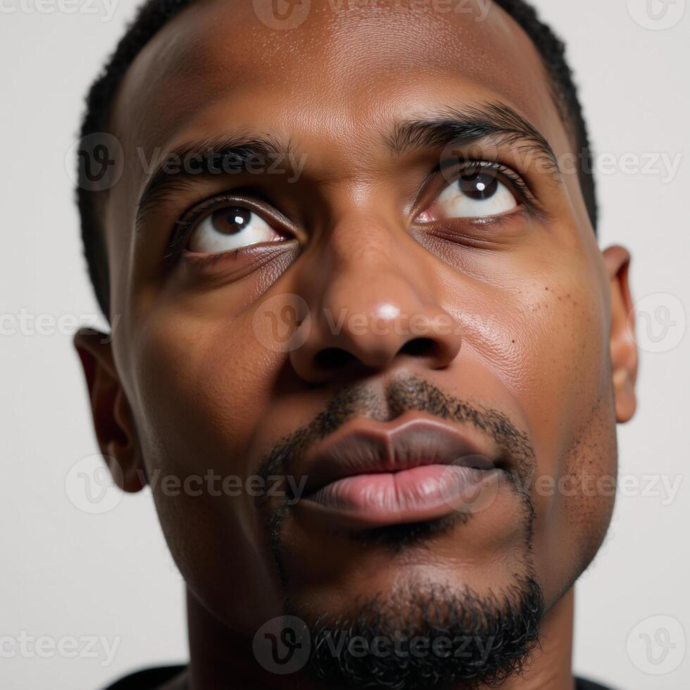 Closeup portrait showcasing an introspective African American male photo