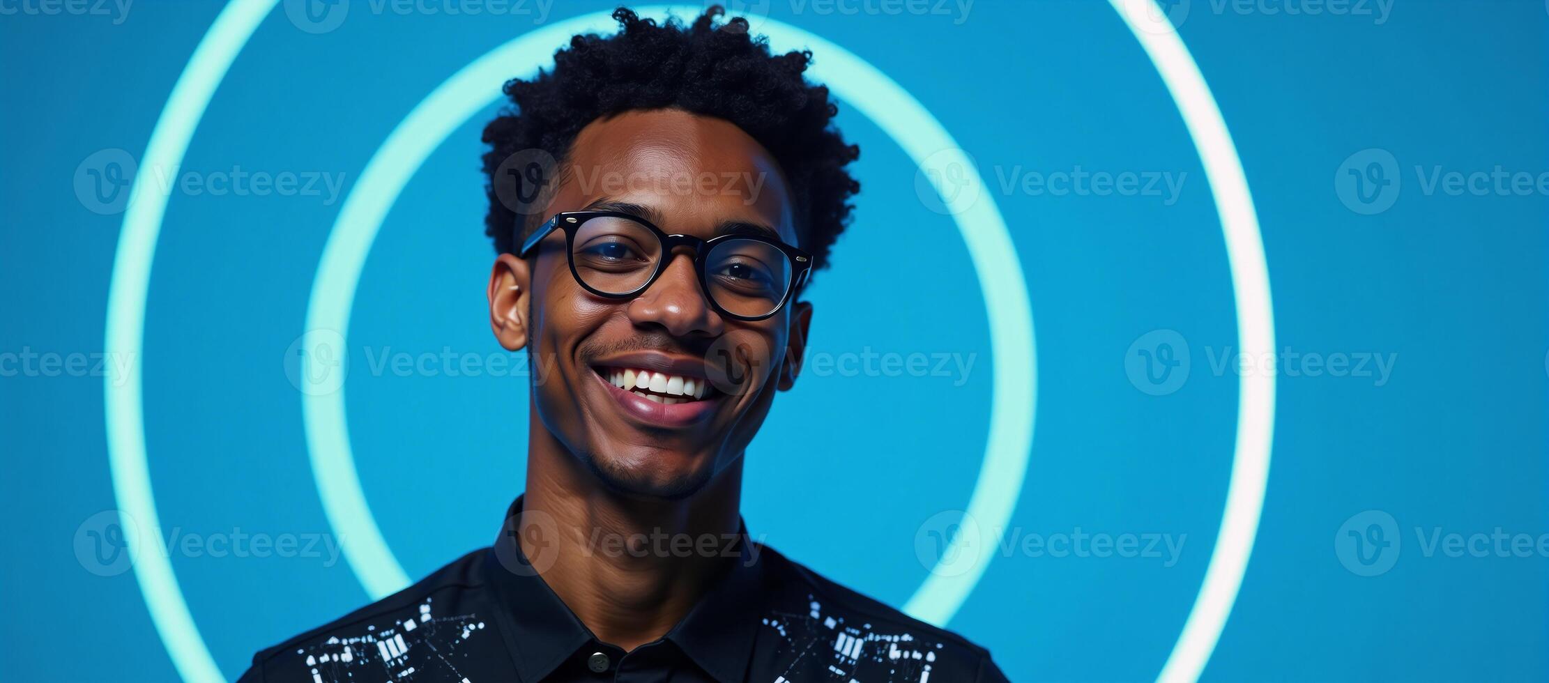 A stylish cyberinspired portrait of a young African American man wearing glasses against a blue backdrop embodying a sense of technological prowess and the future photo