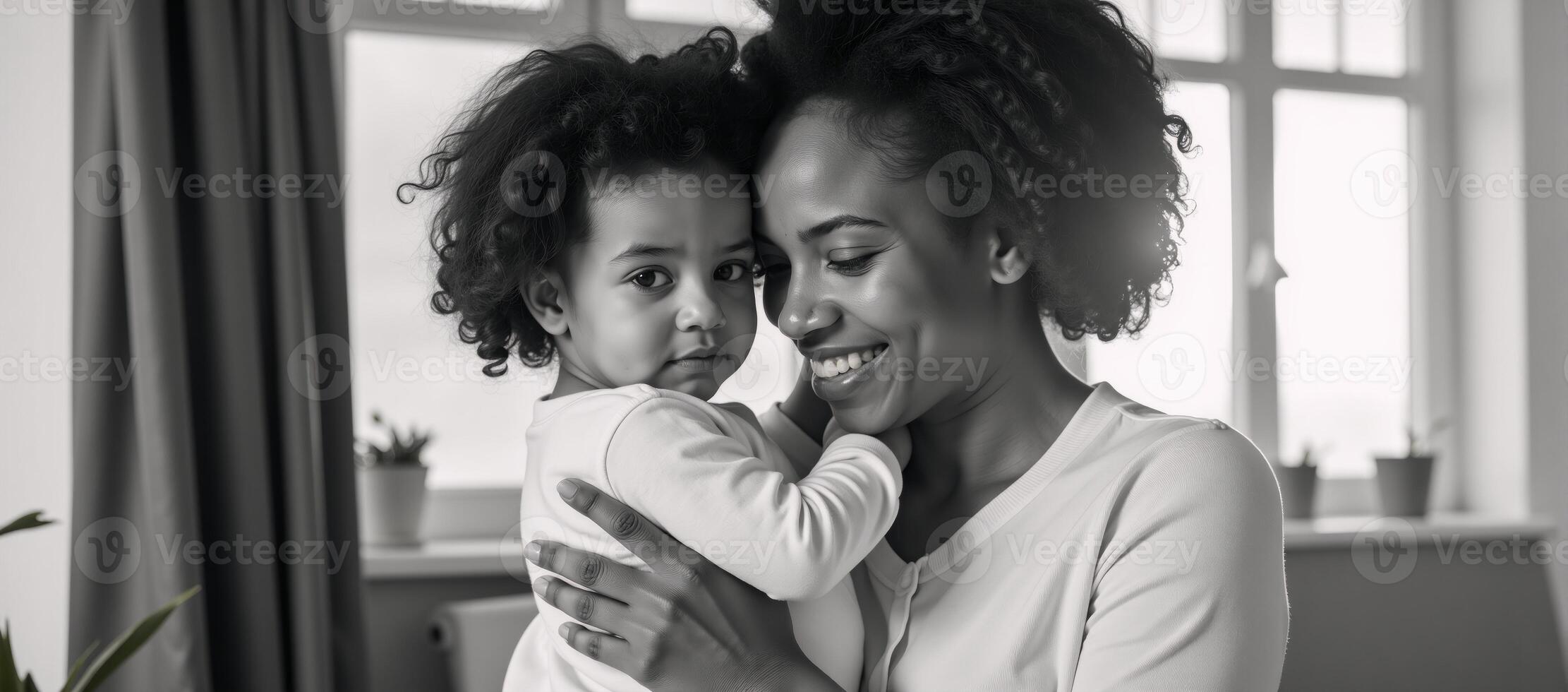 An AfricanAmerican mother tenderly embraces her child photo