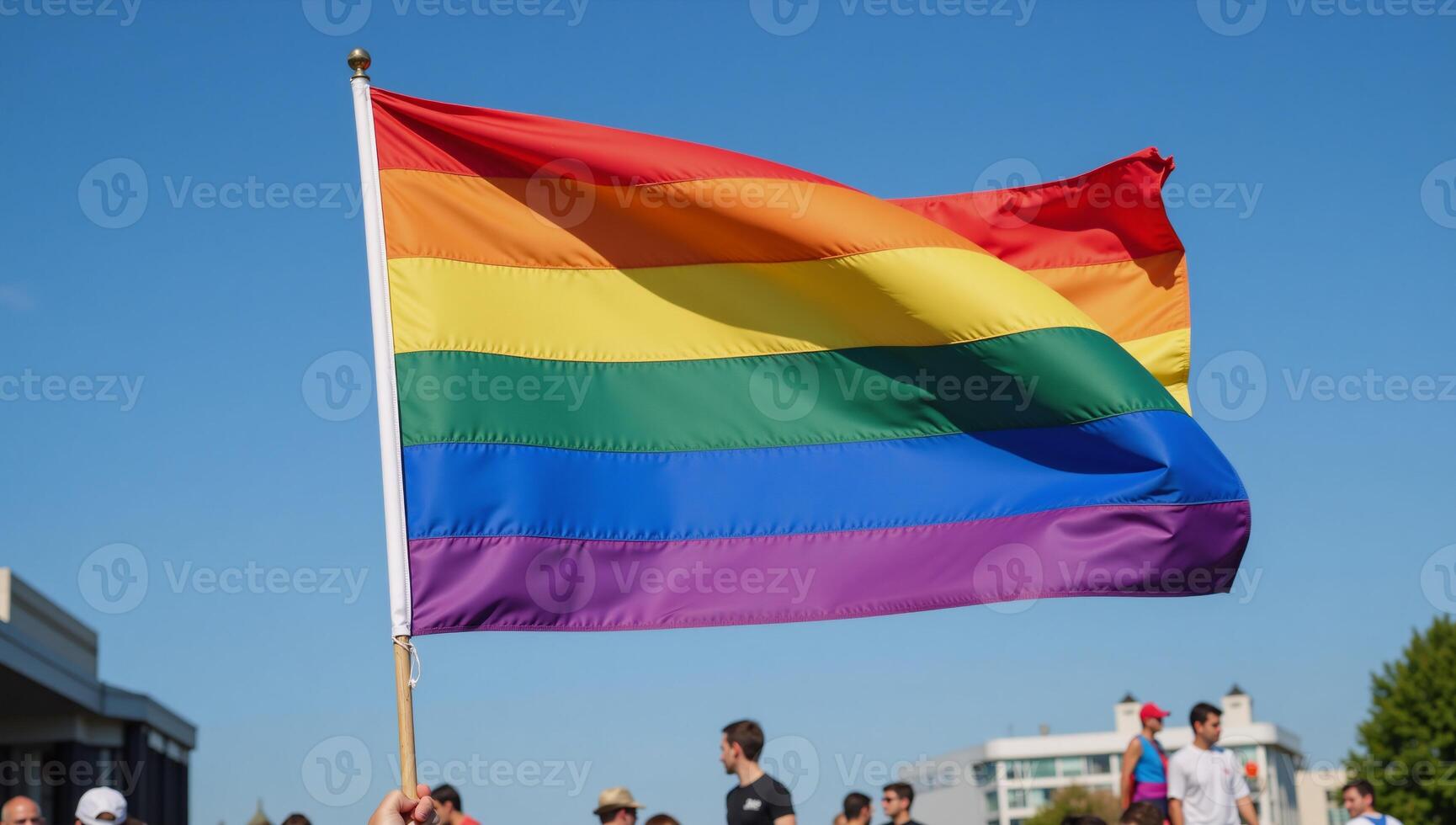 Celebratory scene showcasing a new Pride Flag design soaring against a blue sky symbolizing LGBTQ community unity and pride photo