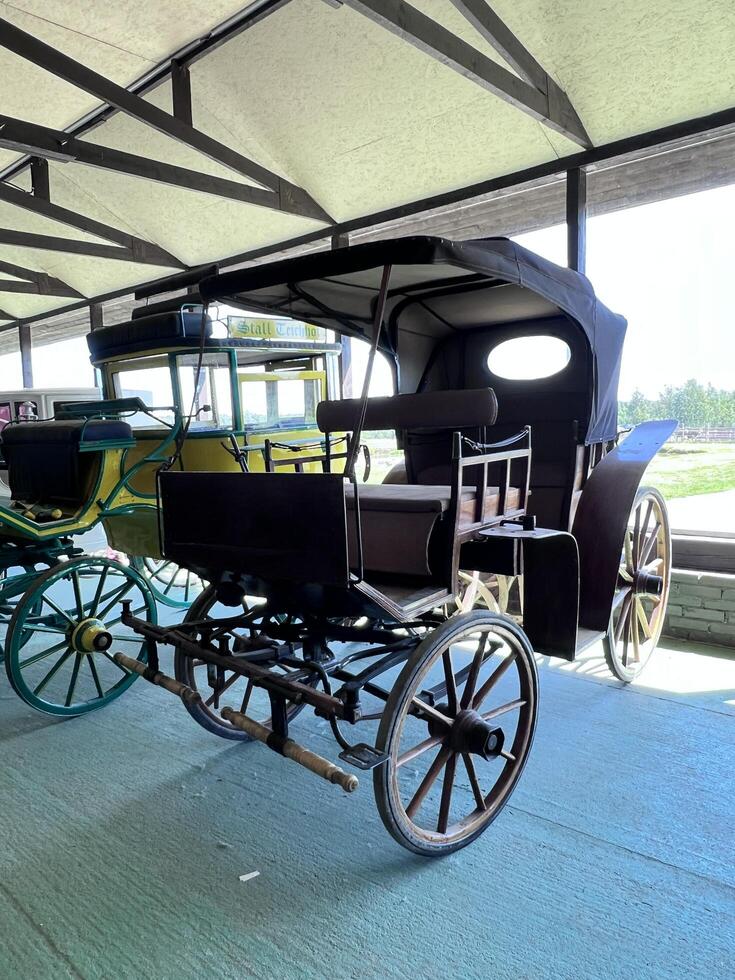 an old fashioned carriage is parked in a building photo