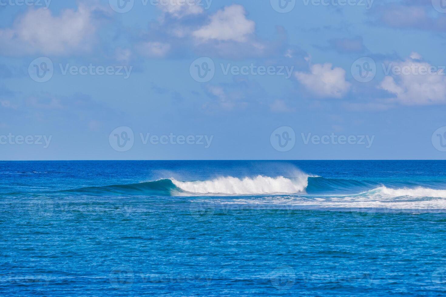 Crystal clear sea water bay. Pristine ocean lagoon sunny cloudy sky, idyllic relaxing seascape. Transparent surface, exotic travel. Splash Mediterranean nature panorama. Summer background, beach view photo