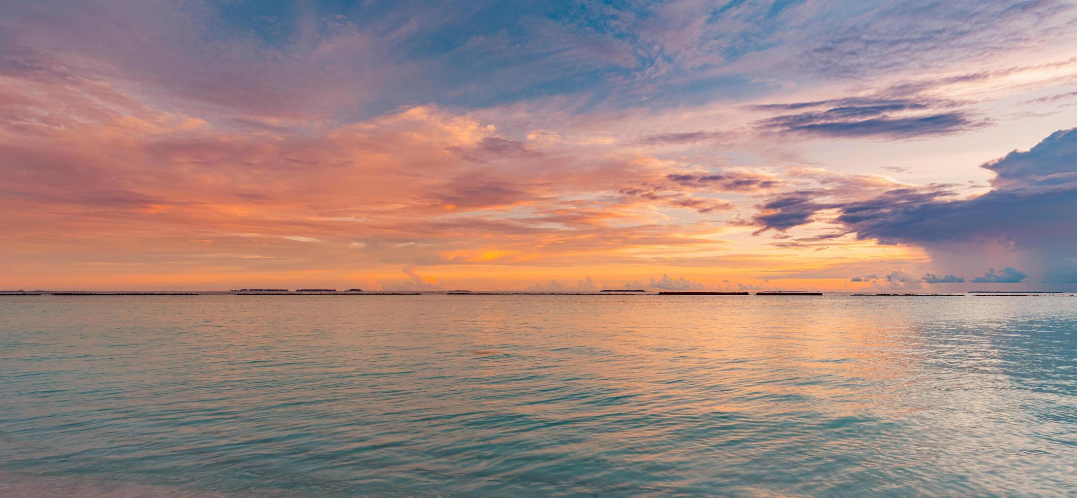 Panoramic sea skyline beach. Amazing sunrise beach landscape. Panorama of tropical beach seascape horizon. Abstract colorful sunset sky light tranquil relax summer seascape freedom wide angle seascape photo