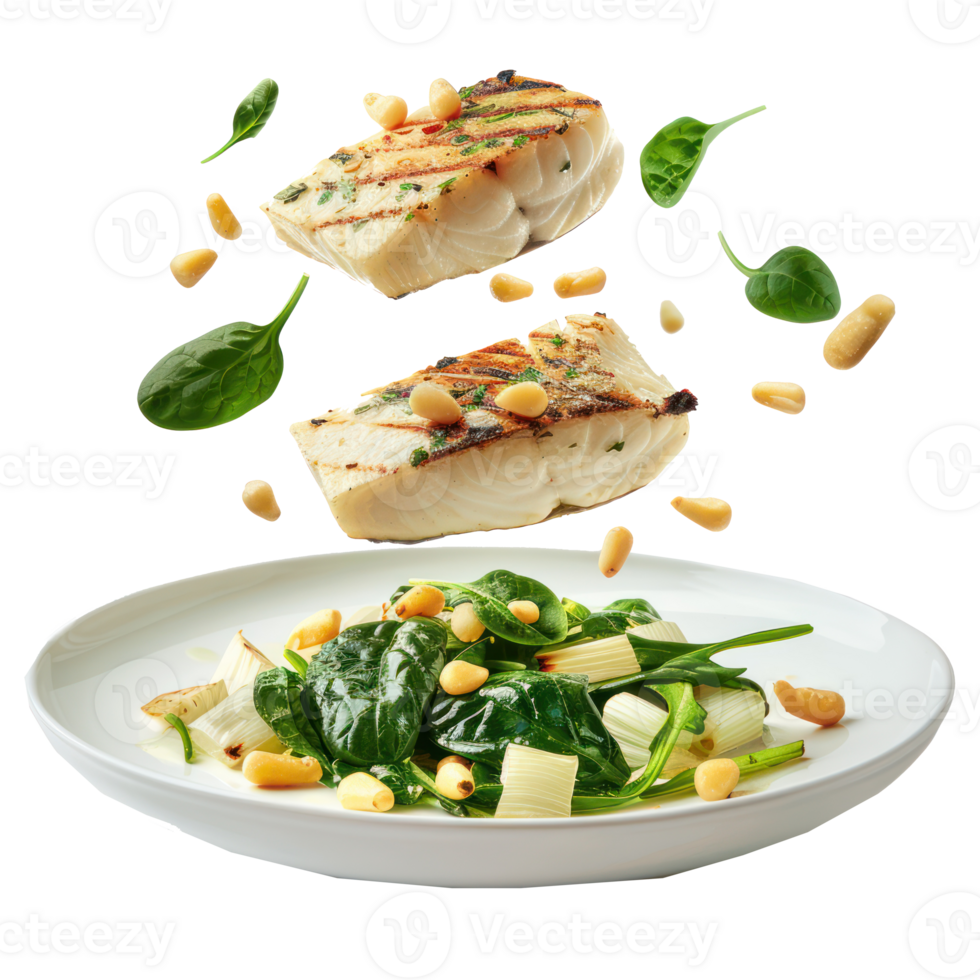 floated Grilled Halibut with Spinach, leeks and Pine Nuts falling into a plate isolate on transparency background png