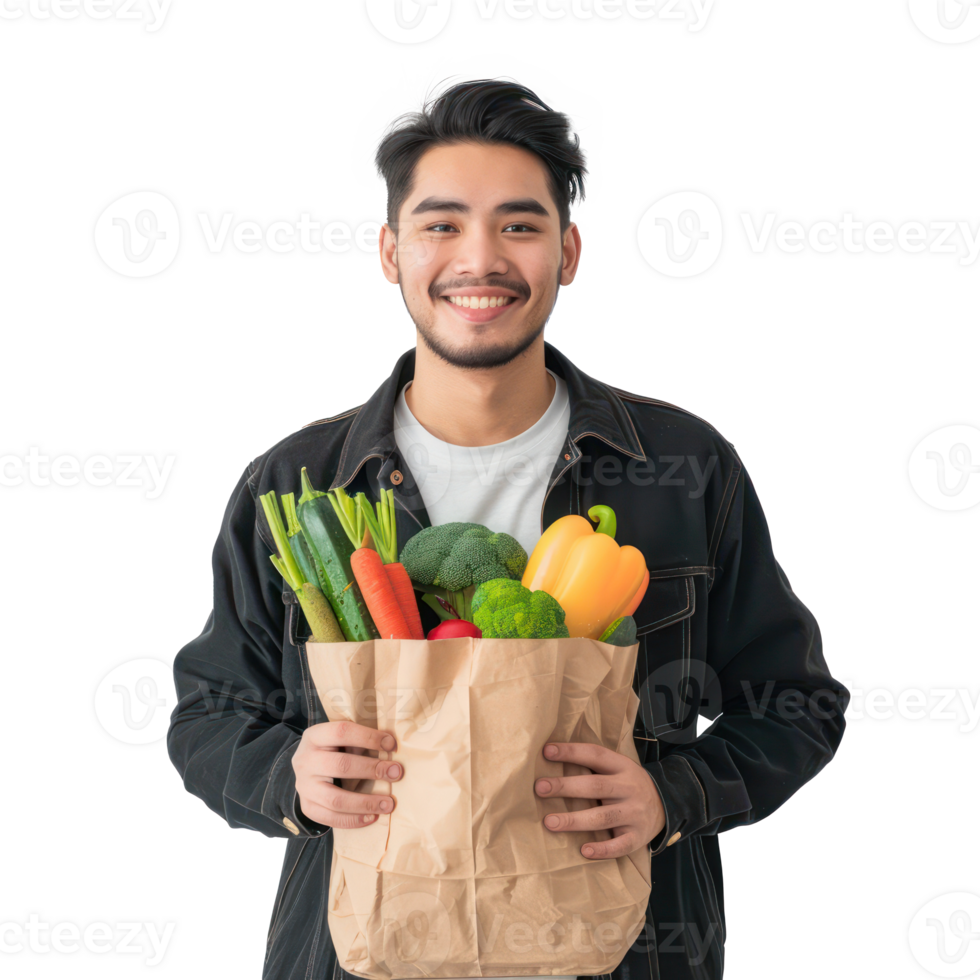 Smiling young man holding groceries vegetable shopping bag standing isolate on transparency background png