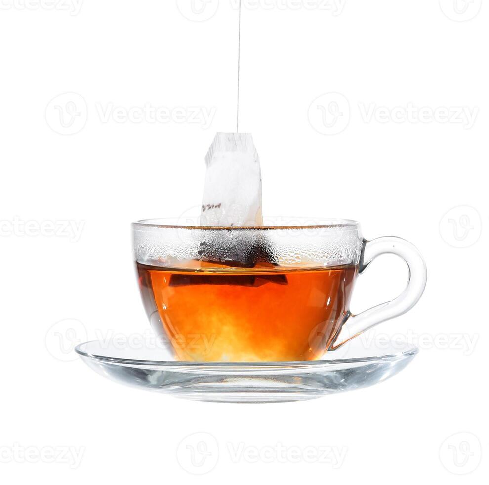 Glass of Tea with Bag End. Isolated on white background, with clipping path photo