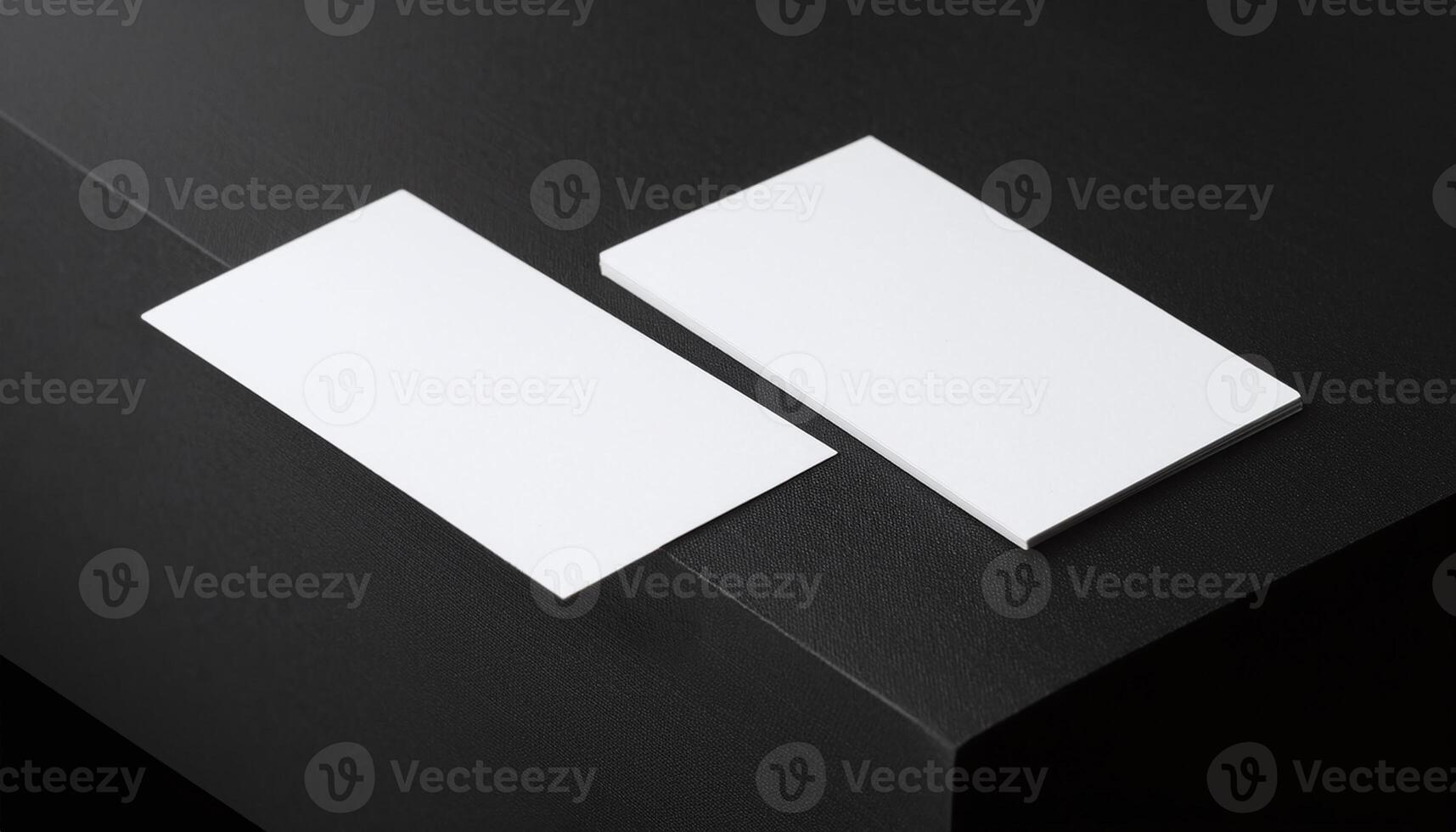 White Blank Business Card on Black Textured Background photo