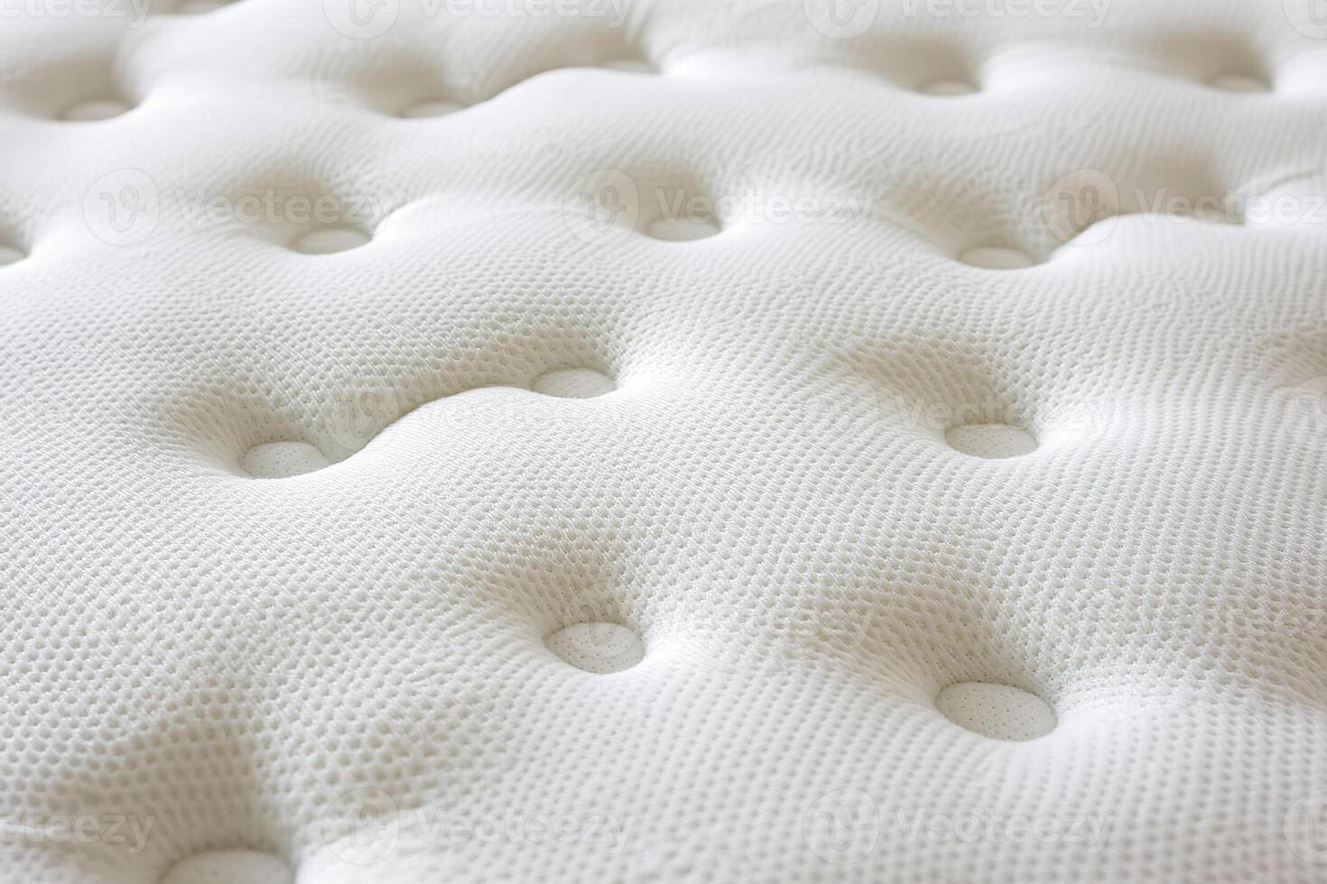 Close up view of white mattresses arranged neatly for customer inspection. photo