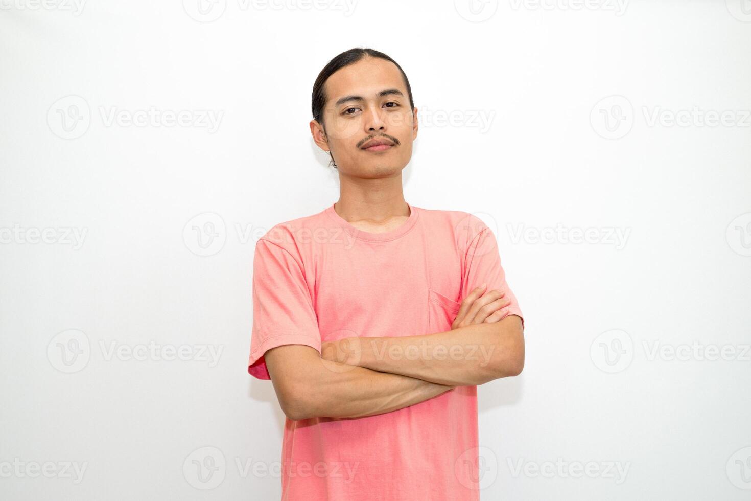 An Indonesian, Asian man wearing a pink tshirt formal style involving his partner with standing confidence like a mature person and a young businessman. isolated in white background photo
