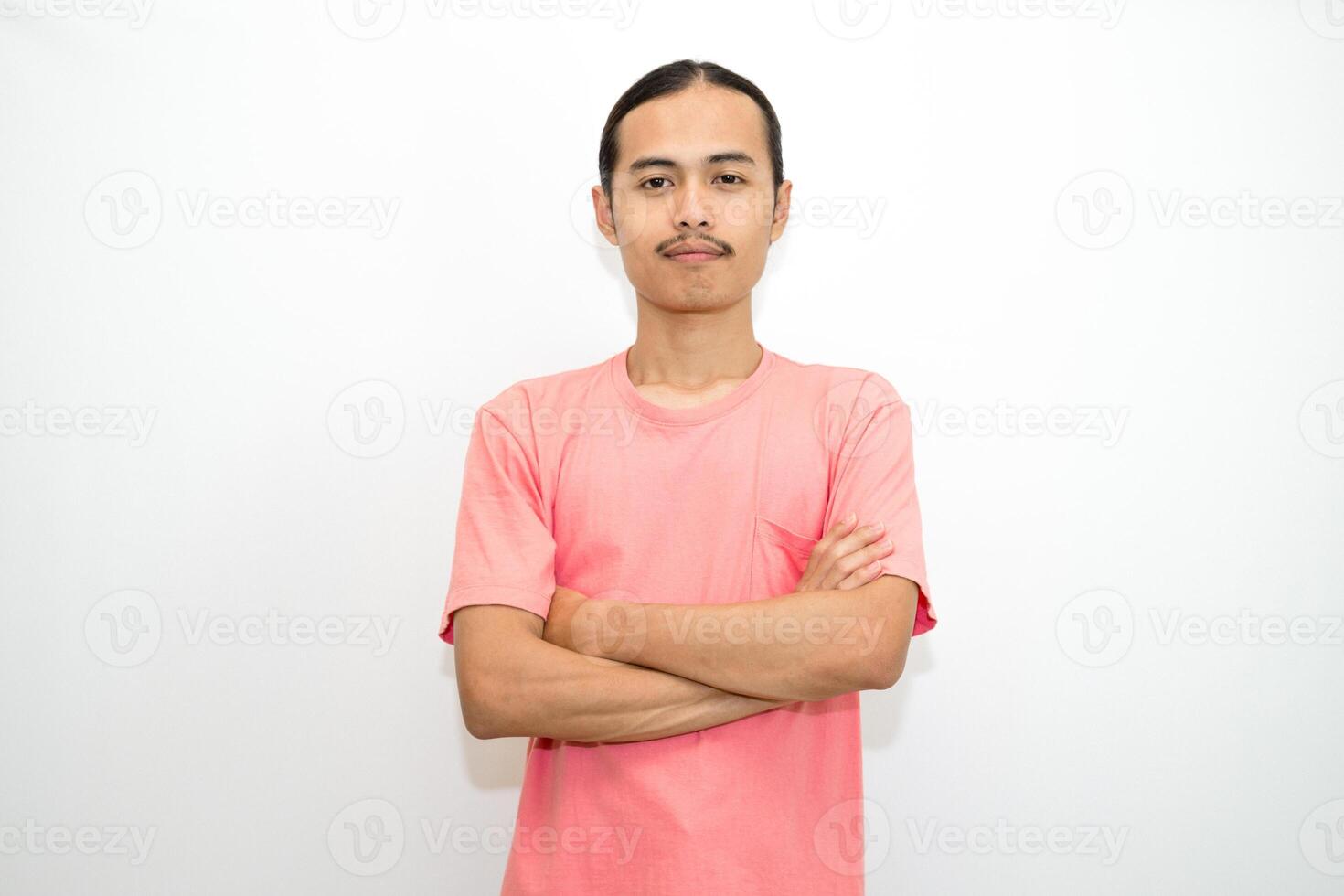 An Indonesian, Asian man wearing a pink tshirt formal style involving his partner with standing confidence like a mature person and a young businessman. isolated in white background photo