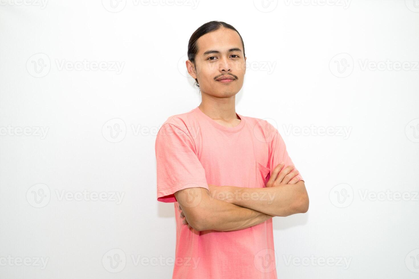 An Indonesian, Asian man wearing a pink tshirt formal style involving his partner with standing confidence like a mature person and a young businessman. isolated in white background photo