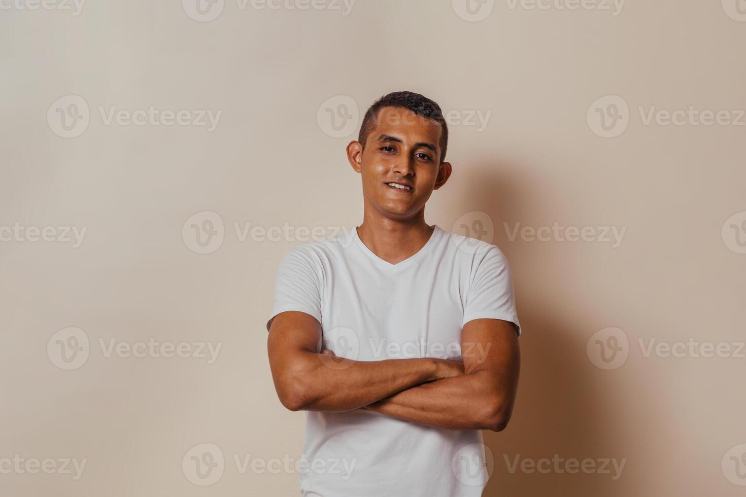 Portrait of hispanic man with arm crossed. photo