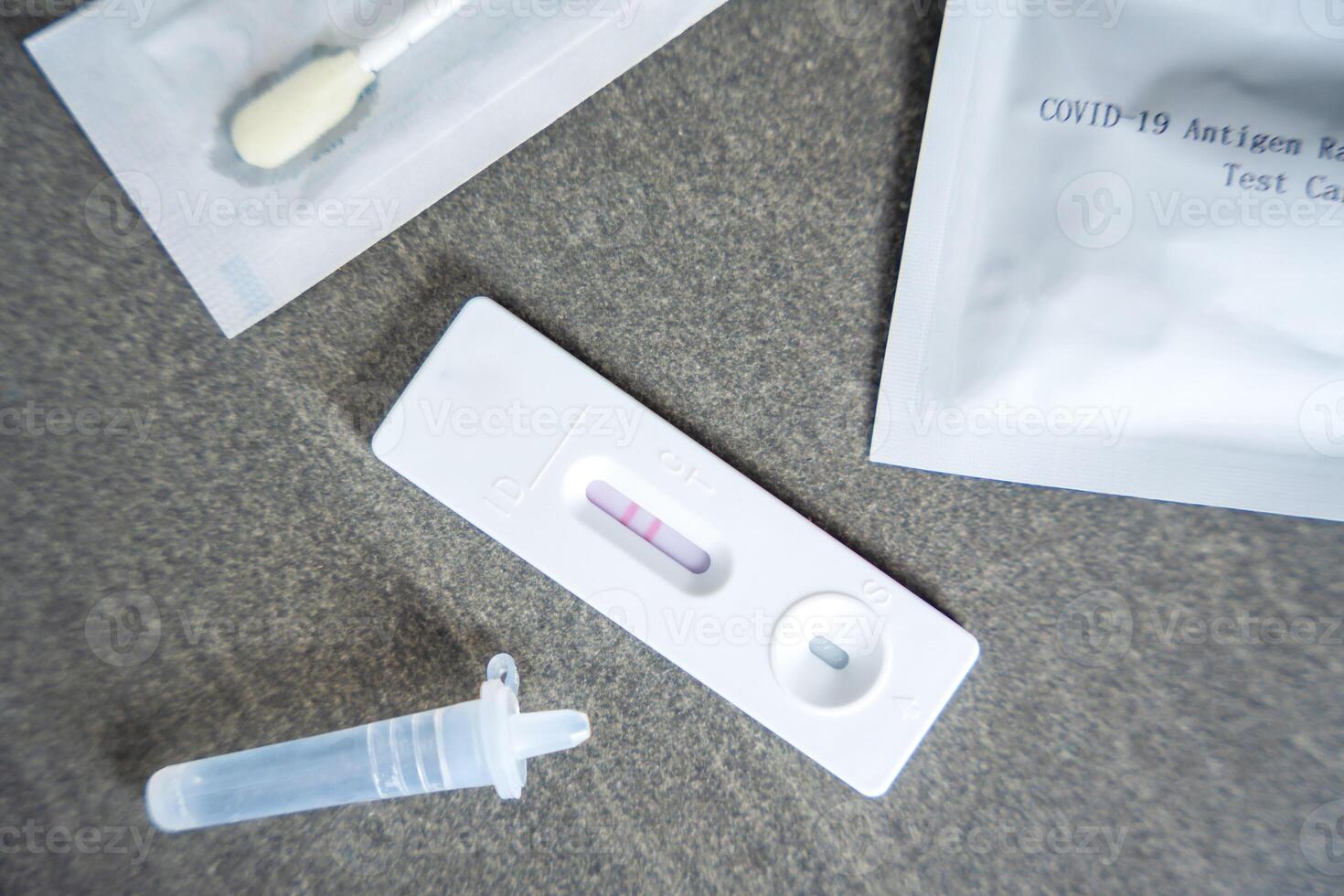 Rapid Antigen Test kit with with Positive result during swab COVID-19 testing. Coronavirus Self nasal or Home test, Autumn exacerbation of viruses. High quality photo