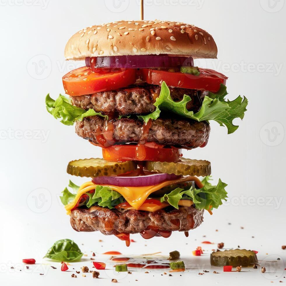 a hamburger with lettuce, tomato, onion and pickles photo