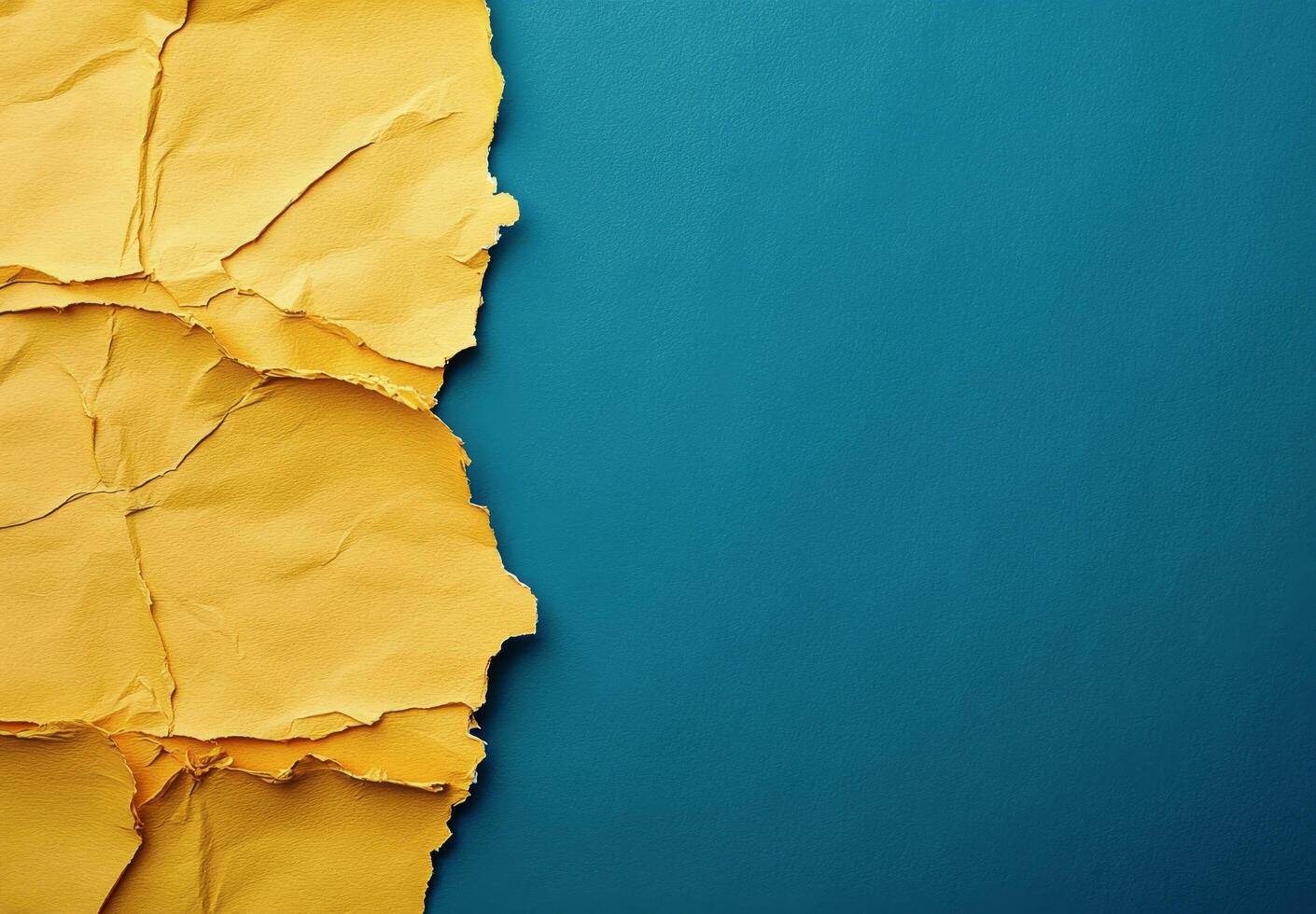 Textured yellow paper against vibrant blue background creating visual contrast and interest photo