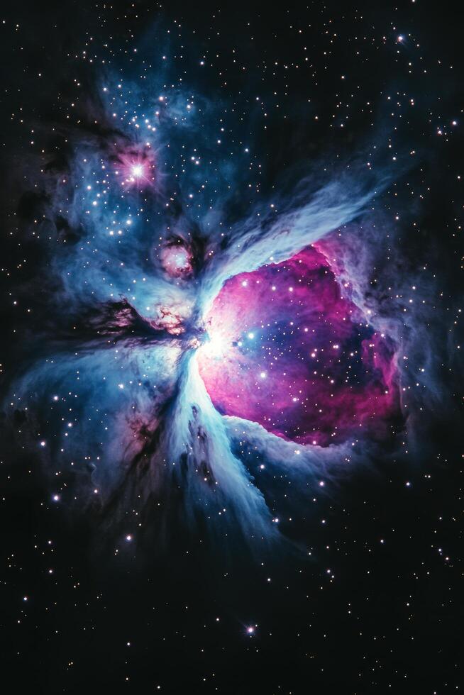 A stunning view of a vibrant nebula illuminated by distant stars in the vastness of space photo