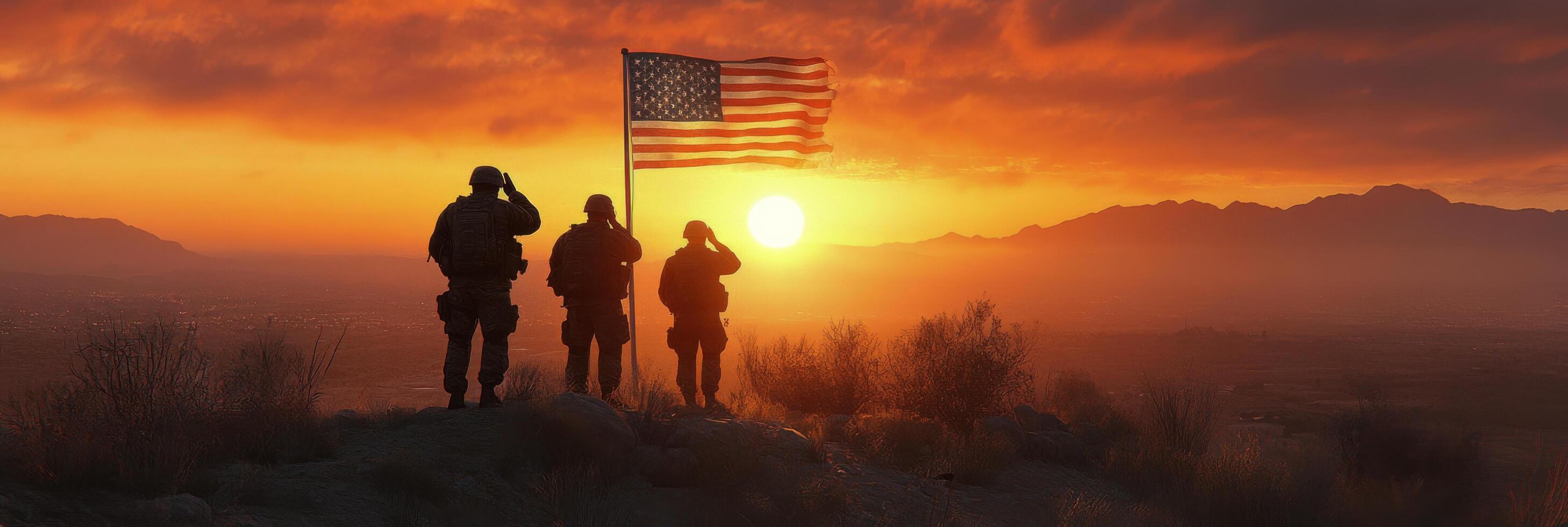 Three soldiers stand on a hillside, saluting while holding an American flag during a stunning sunset photo