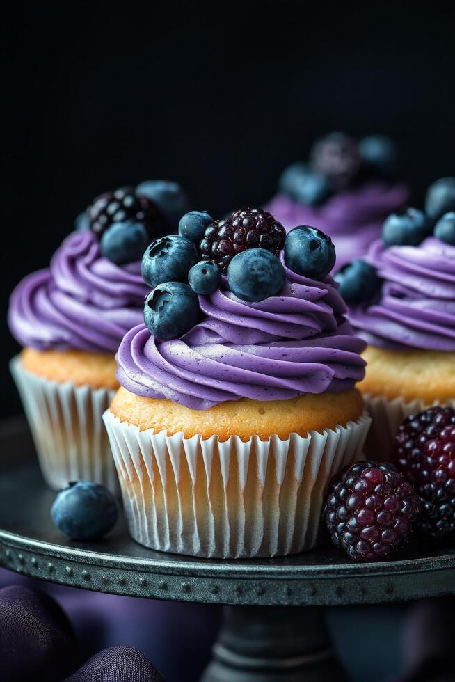 Delicious cupcake topped with cream and berries on a dark surface, perfect for dessert lovers photo
