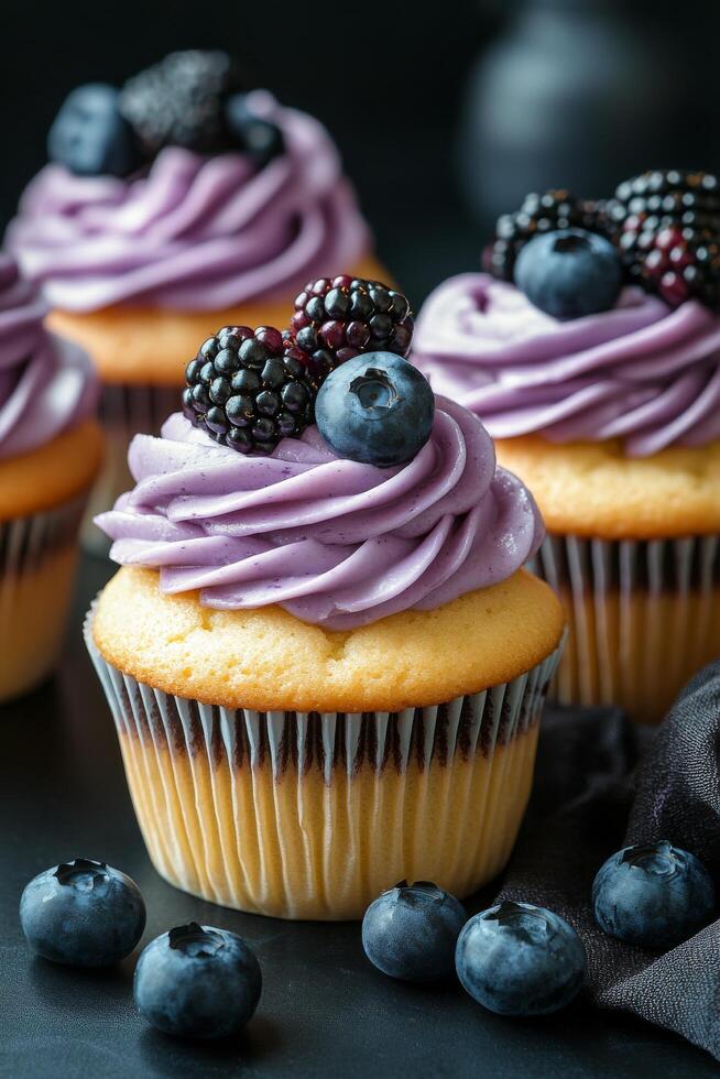 Delicious cupcake topped with cream and berries on a dark surface, perfect for dessert lovers photo