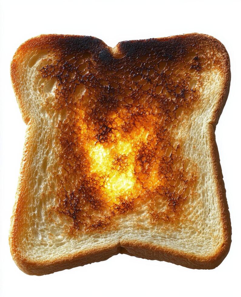 Toasted bread slice with unique burn design on a white background capturing warmth and texture photo