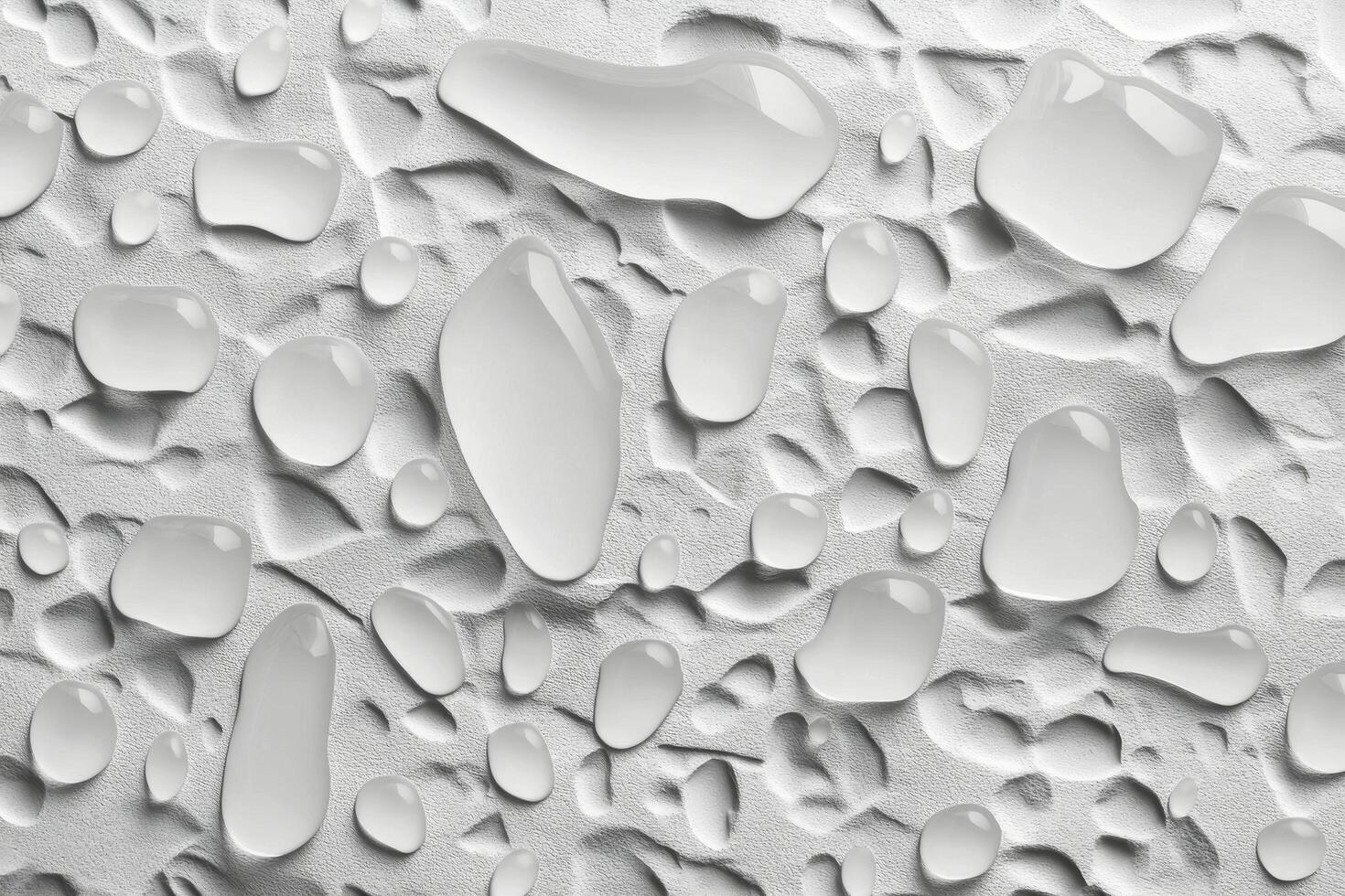 Raindrops on a smooth grey surface creating intriguing patterns and reflections photo
