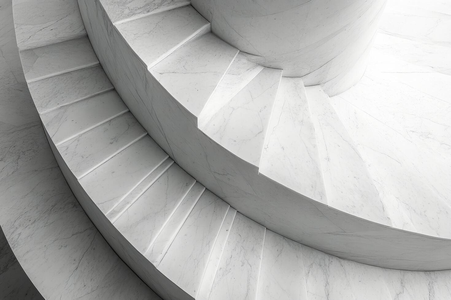 Elegant spiral staircase captured from above in a historic building with intricate design details photo