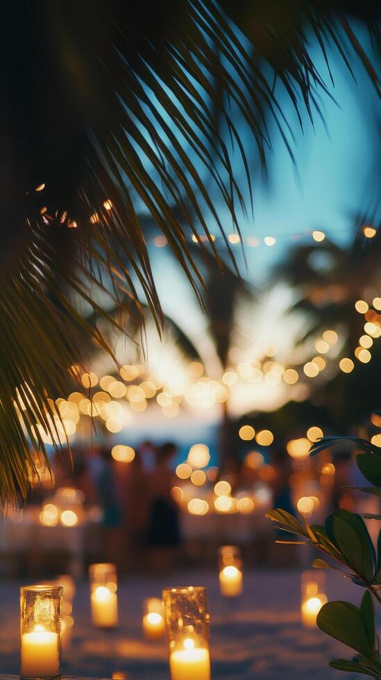 A summer evening gathering with warm lights in a tropical setting surrounded by lush greenery photo