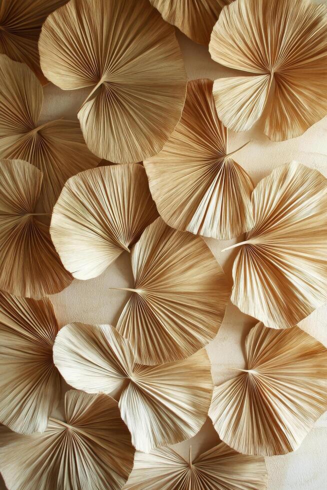 Decoratively arranged dried palm leaves creating a textured wall display in natural light photo