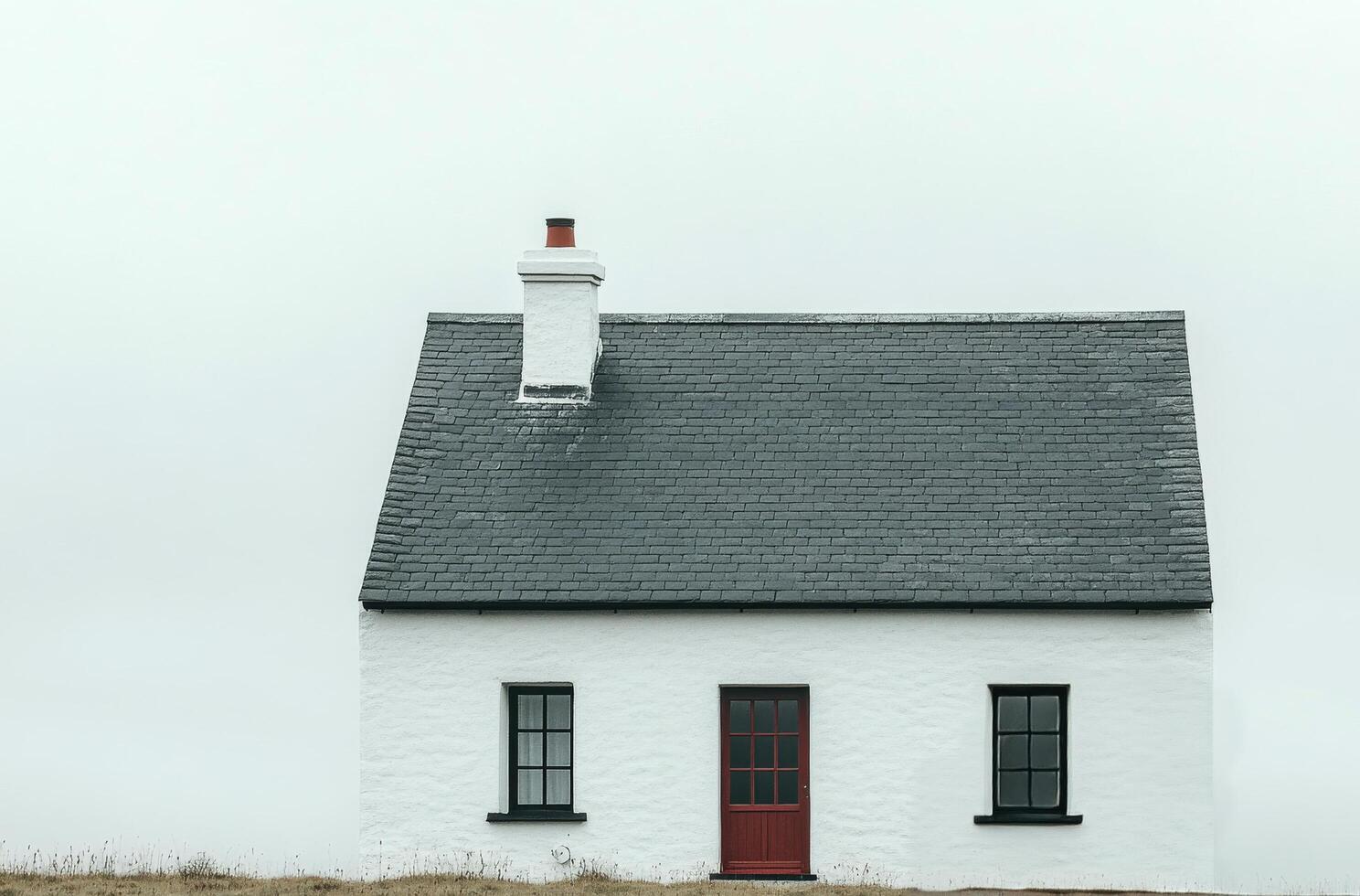A minimalist white house with a sleek roof design against a cloudy sky in a serene landscape photo