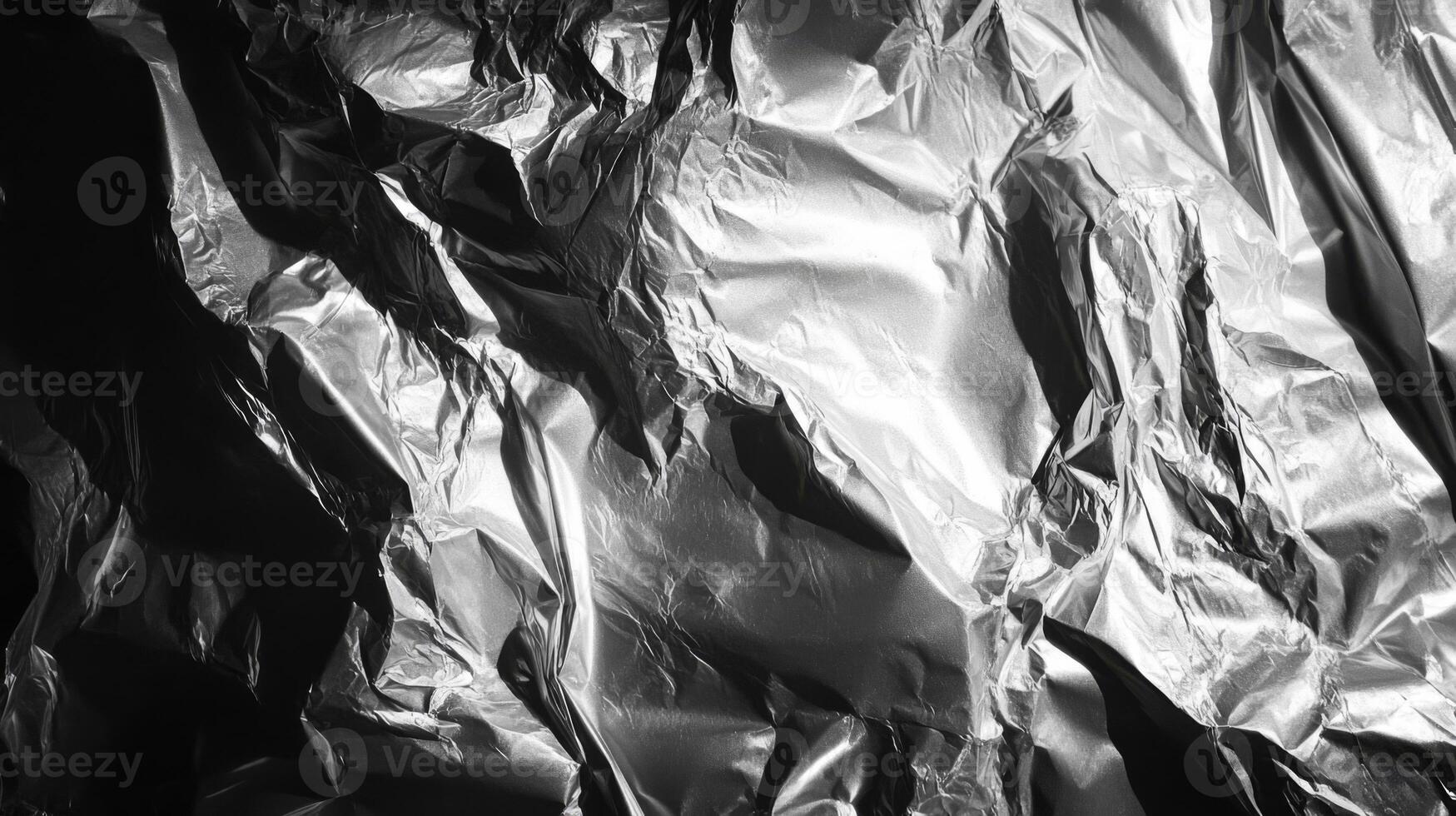Crumpled Silver Foil Texture with Light and Shadow photo