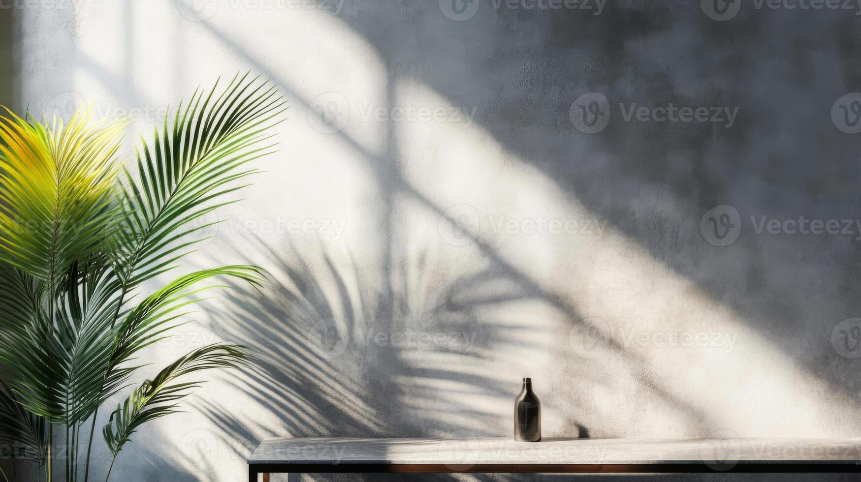 Palm Tree Silhouette and Glass Bottle on a Table with Concrete Wall Background photo