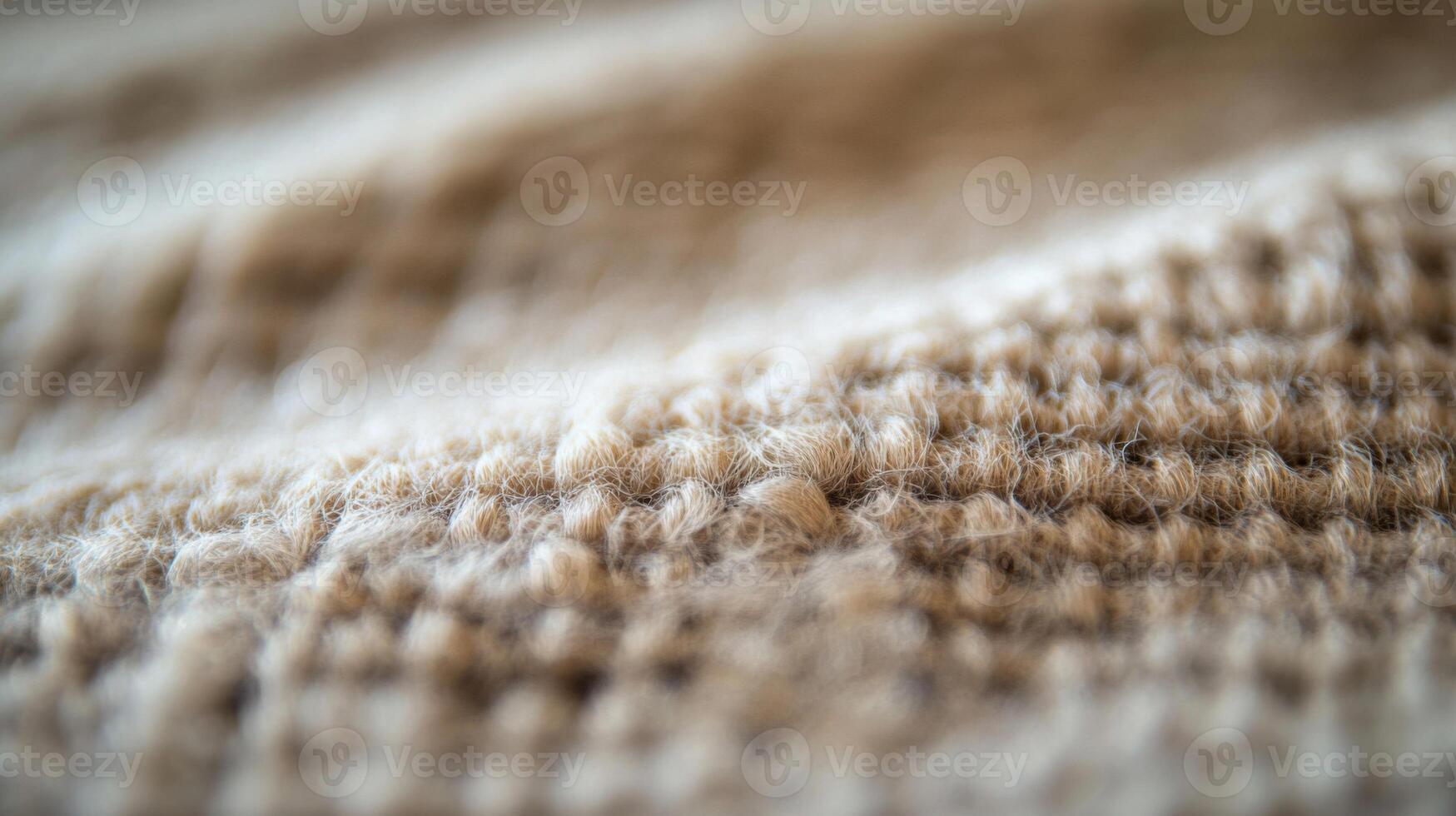 Close-up of a Soft, Tan Knit Fabric with a Fuzzy Texture photo