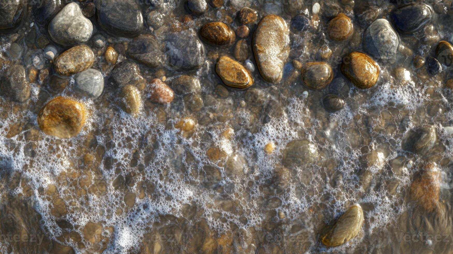 Close-up of Smooth Pebbles Covered in Foamy Water photo