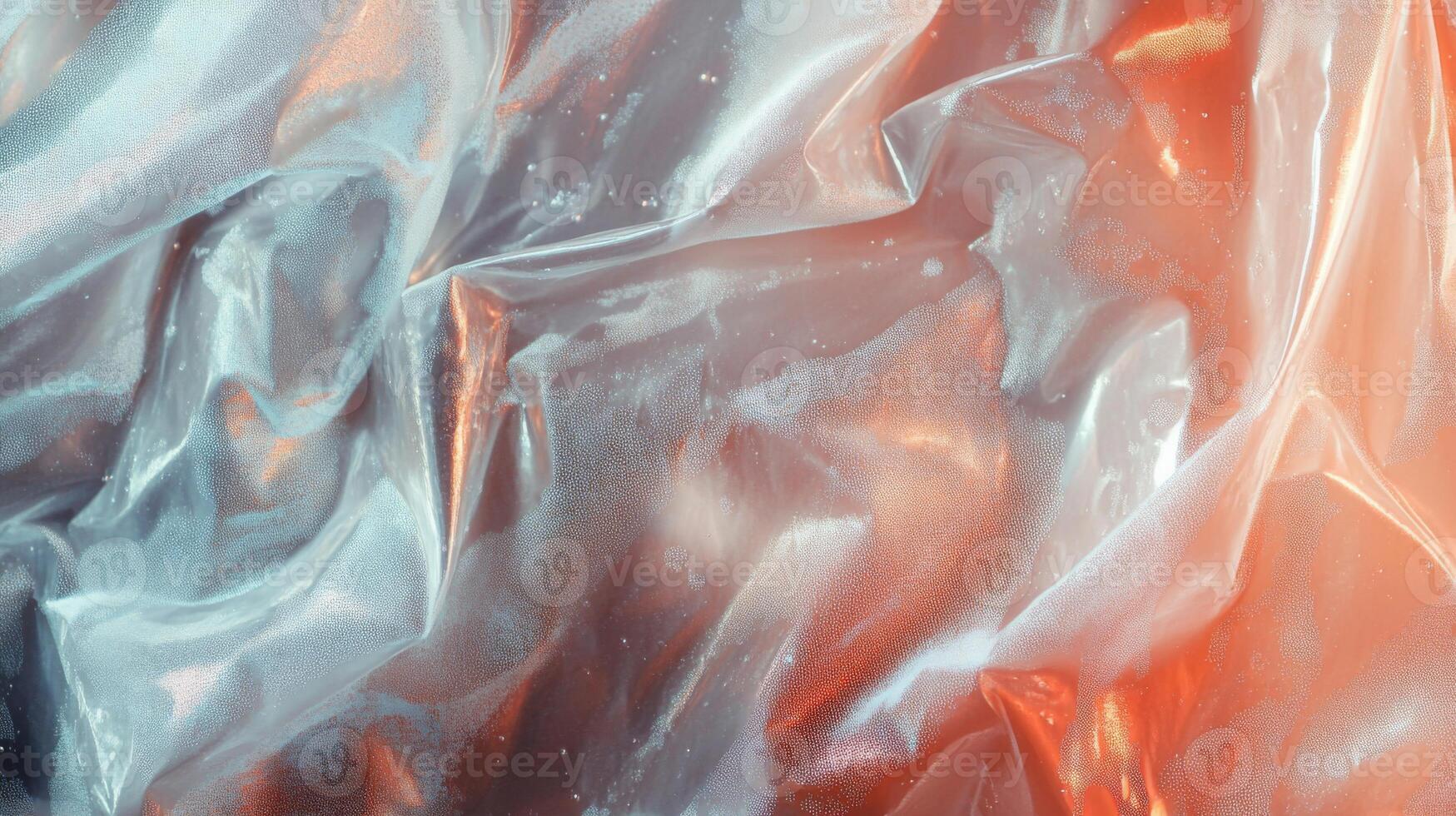 Abstract Close-Up of Crinkled Clear Plastic with Orange Undertones photo