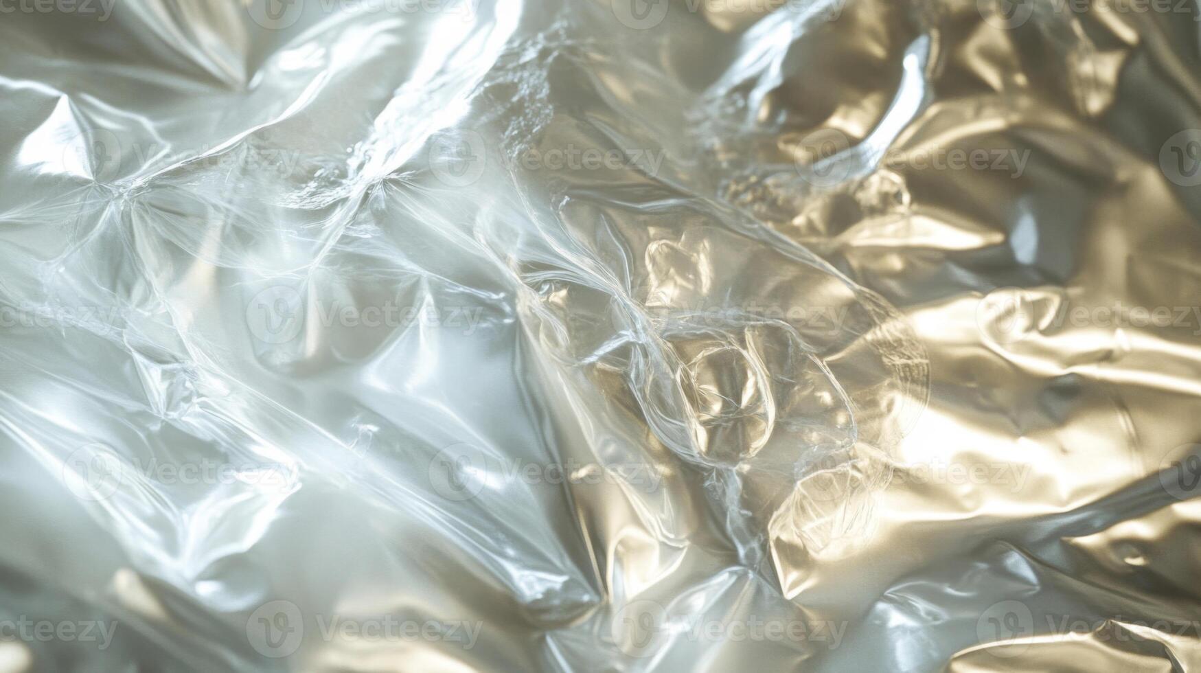 Crinkled Transparent Plastic Sheet with Light Reflections photo