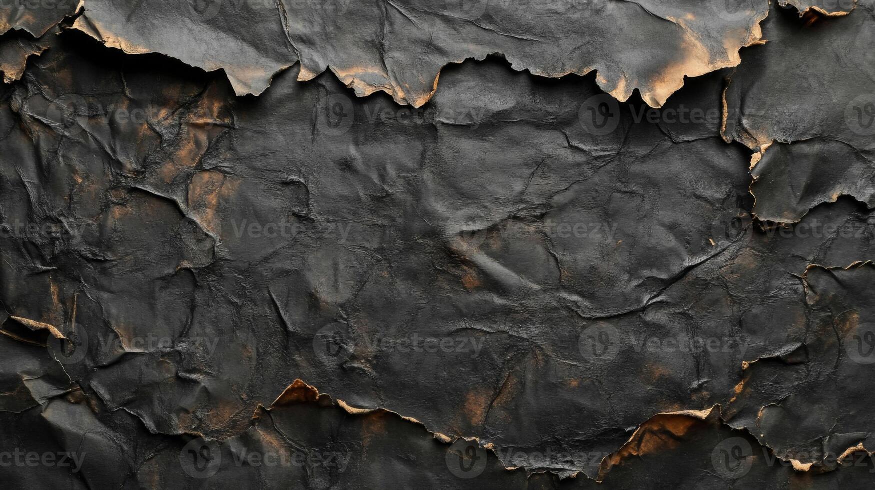 Close-up of Crumpled Black Paper with Ripped Edges photo