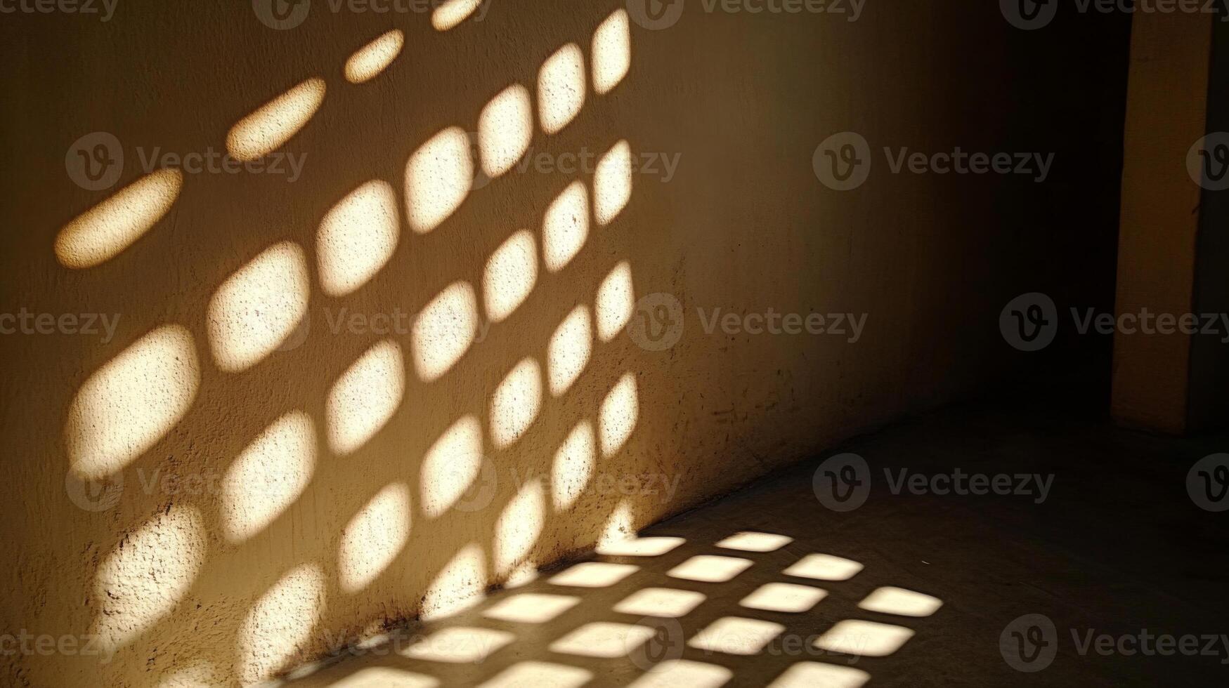 A grid-shaped pattern of light cast on a wall and floor photo