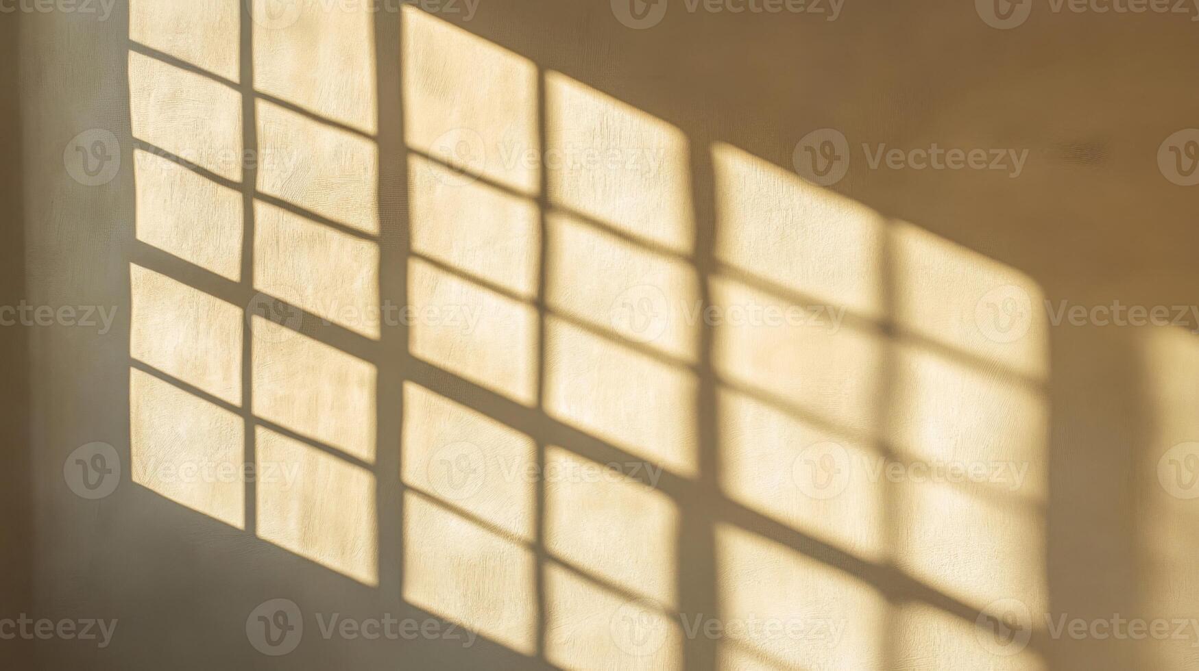 Light and Shadow Cast by a Window on a Cream Wall photo