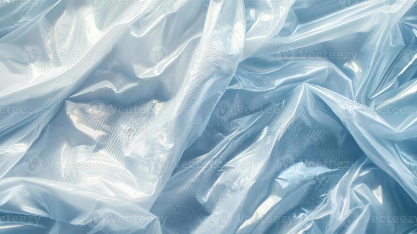Wrinkled, translucent blue plastic wrap photo