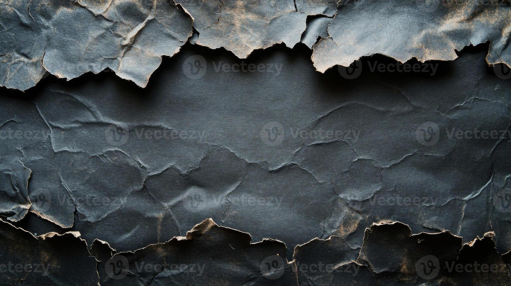 Torn and Crumpled Black Paper with a Rough Texture photo