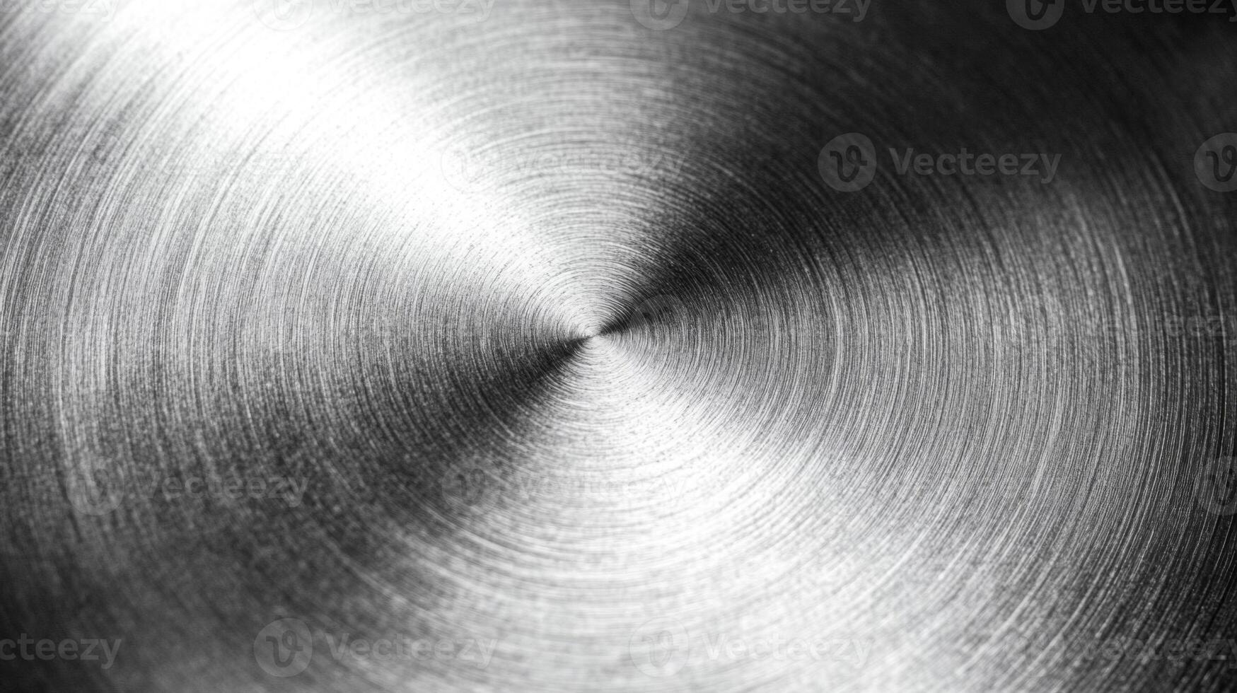 Circular Pattern on a Shiny Metal Surface photo