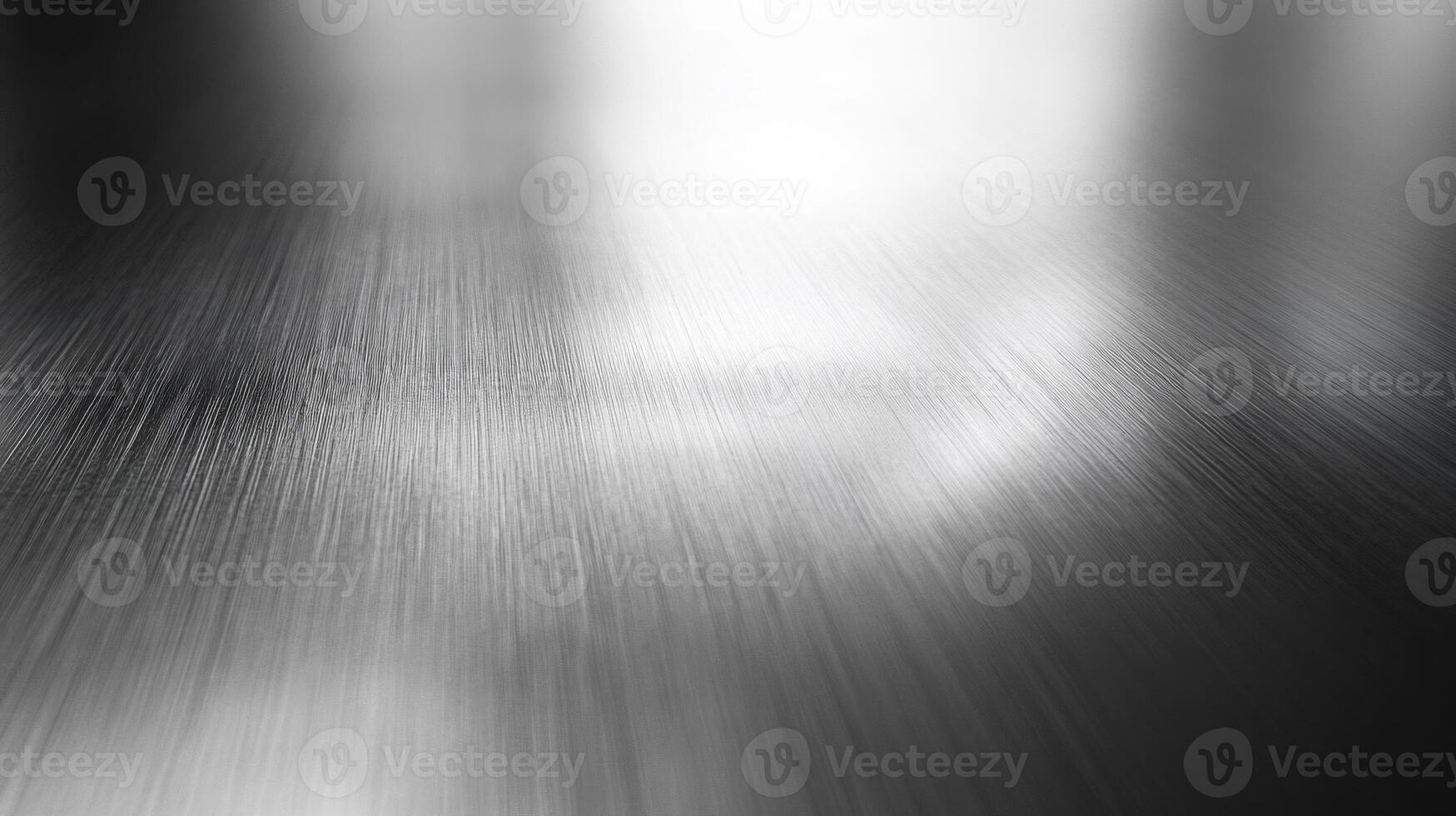 A close-up view of a brushed metal surface with light reflection. photo