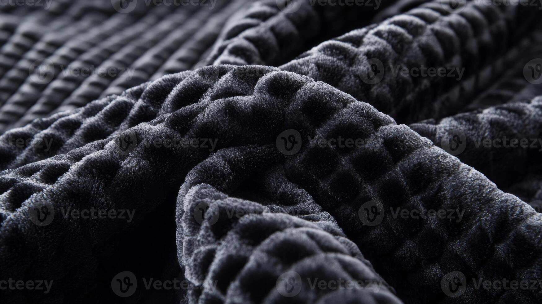 Close-up of a Soft, Black, Quilted Fabric with a Textured Pattern photo