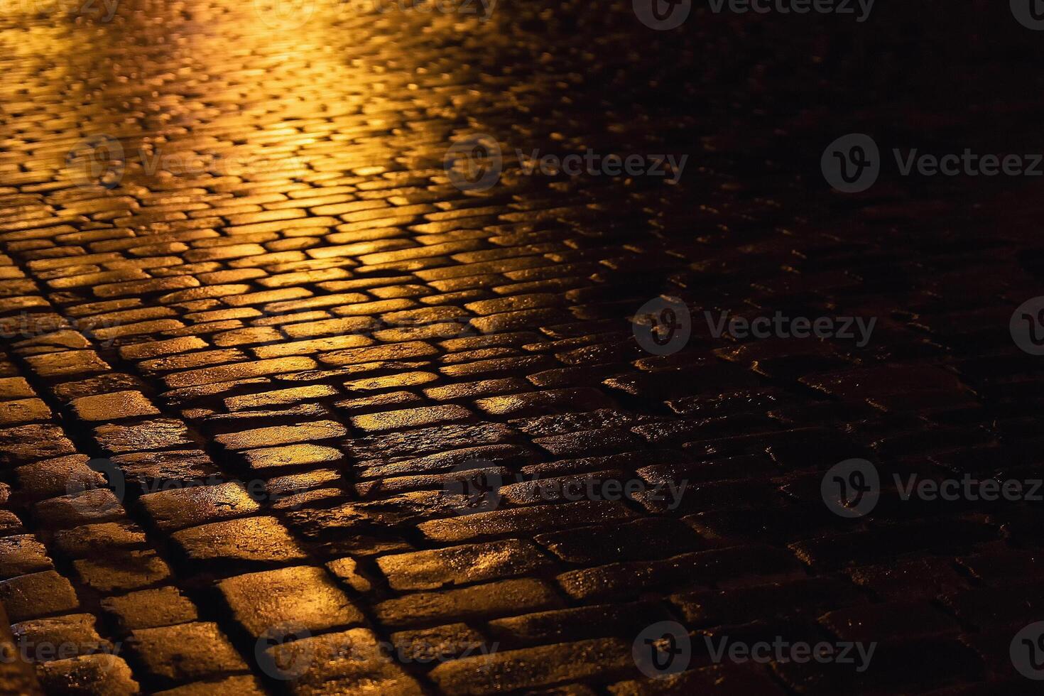 Cobblestone path with golden sunlight of the evening city photo