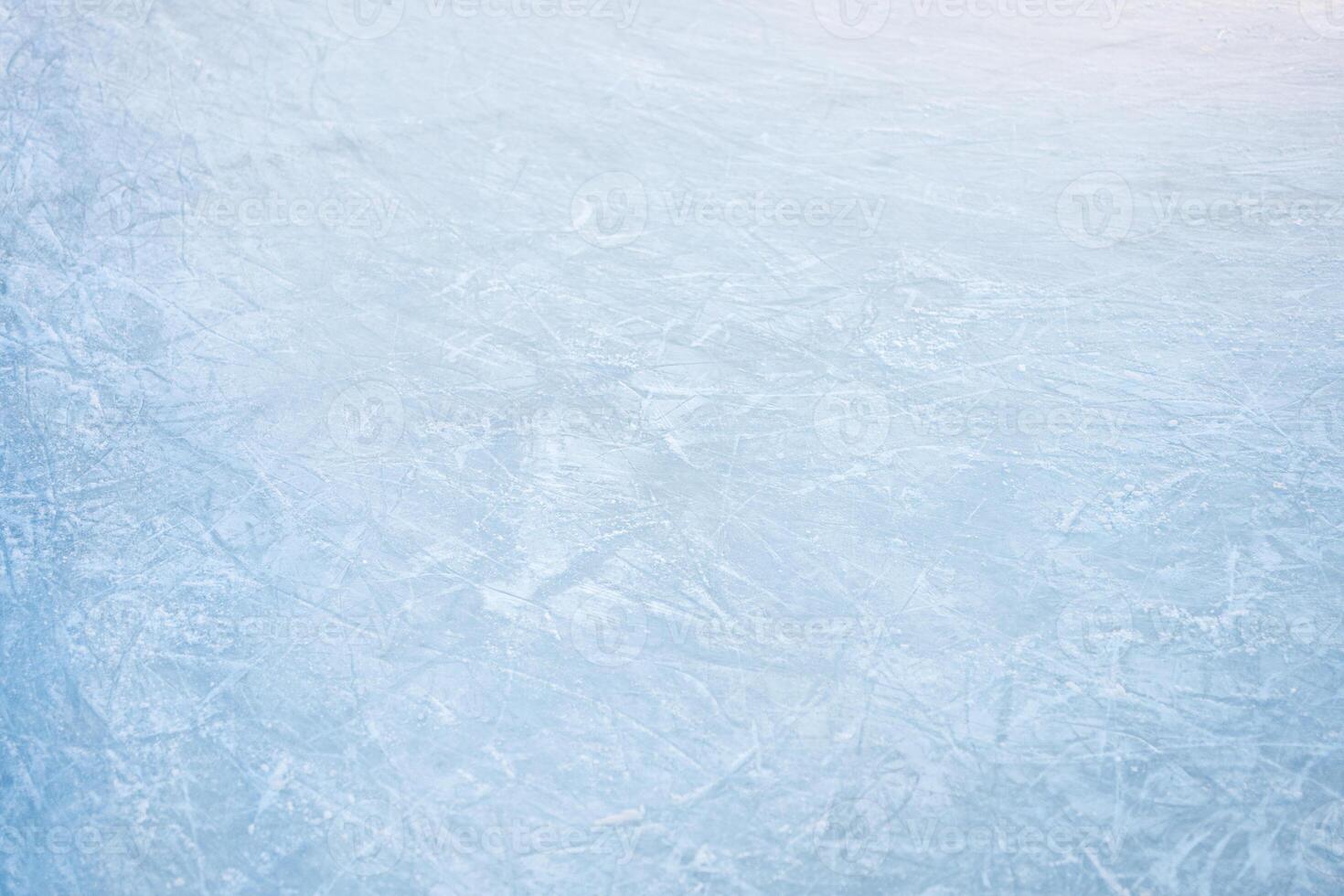 Icy background on rink with visible traces of skating from top view photo